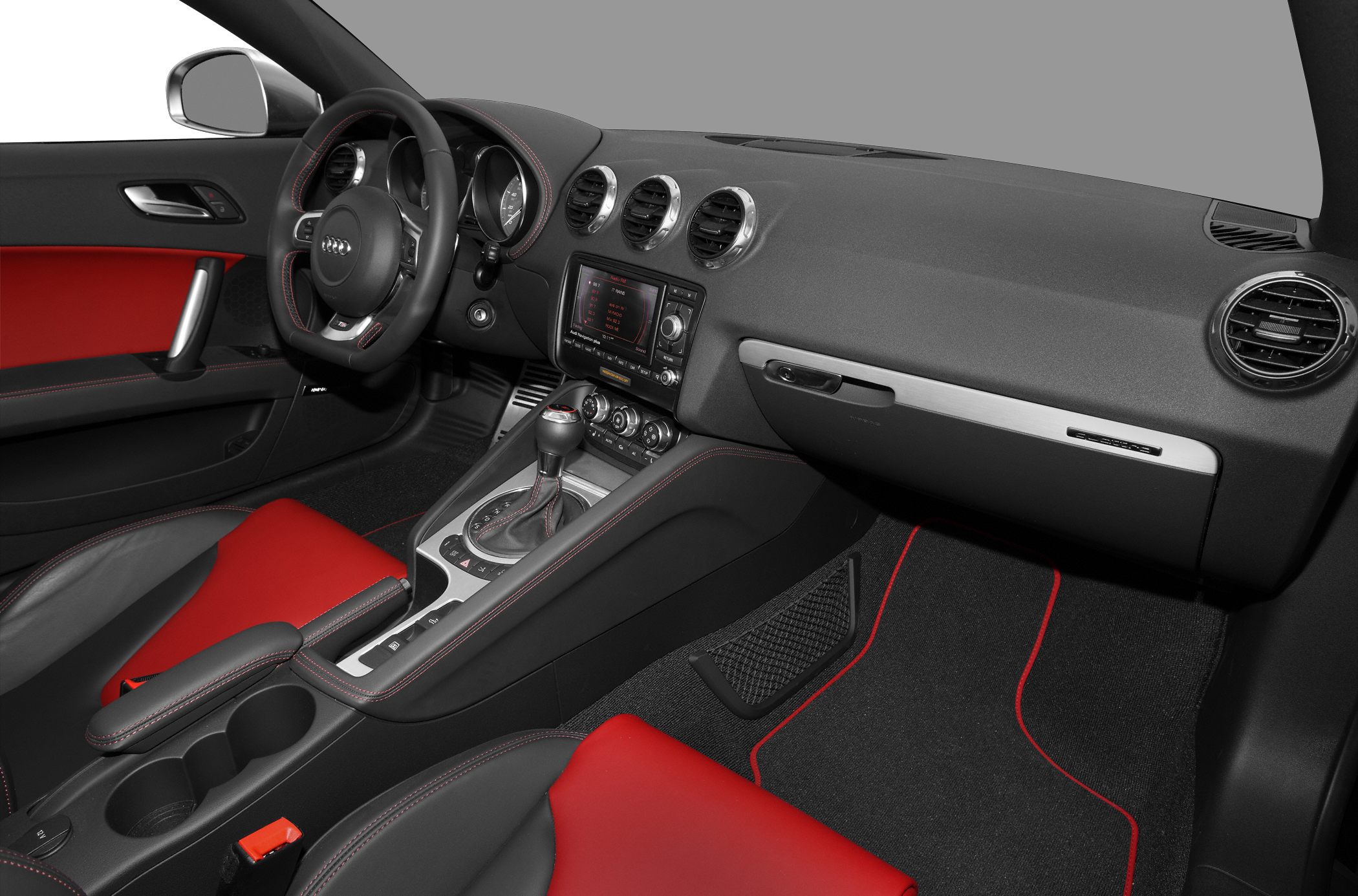 Interior with red-black seats, circular air vents, and center console.