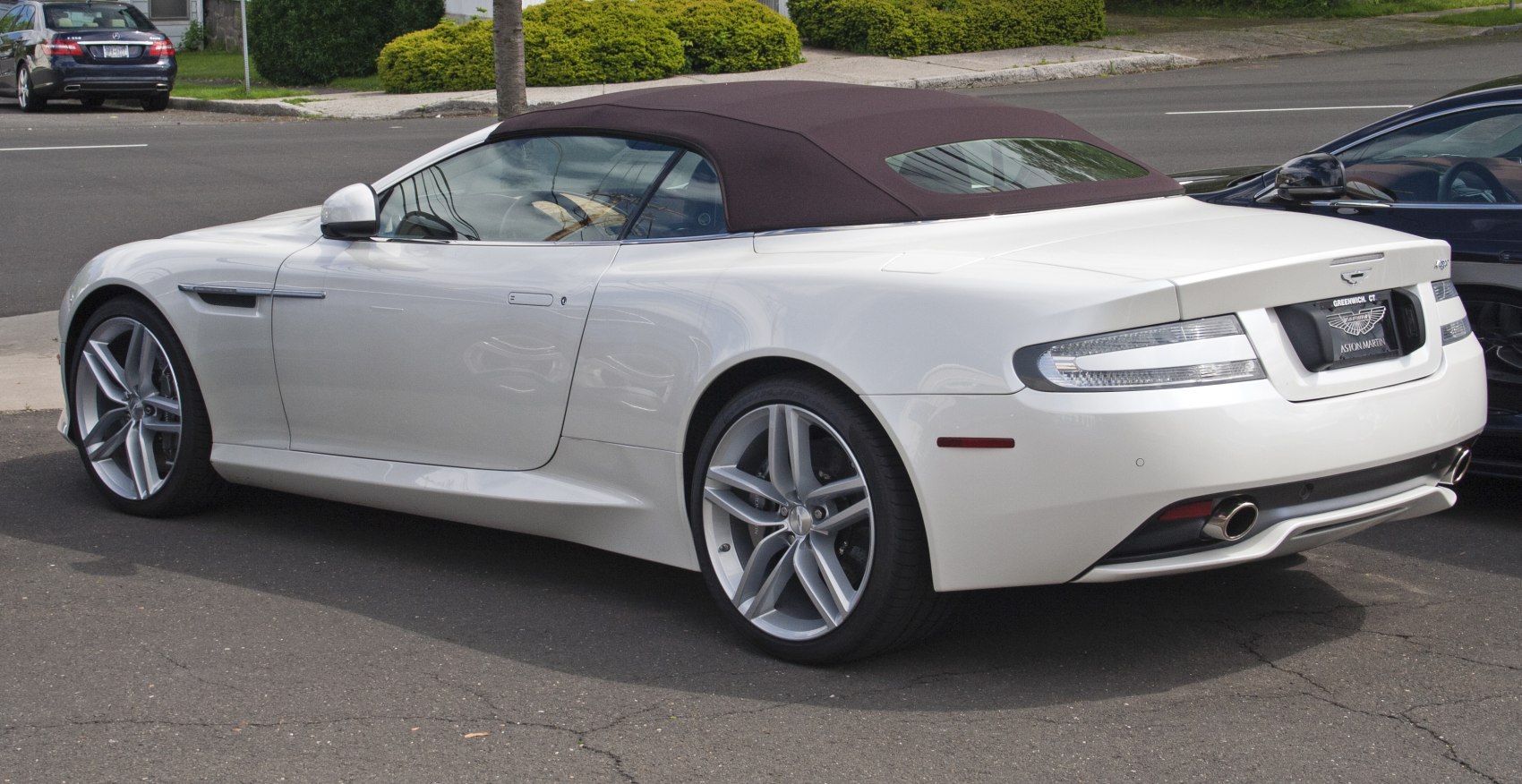 Convertible with soft top roof and sleek rear-side profile
