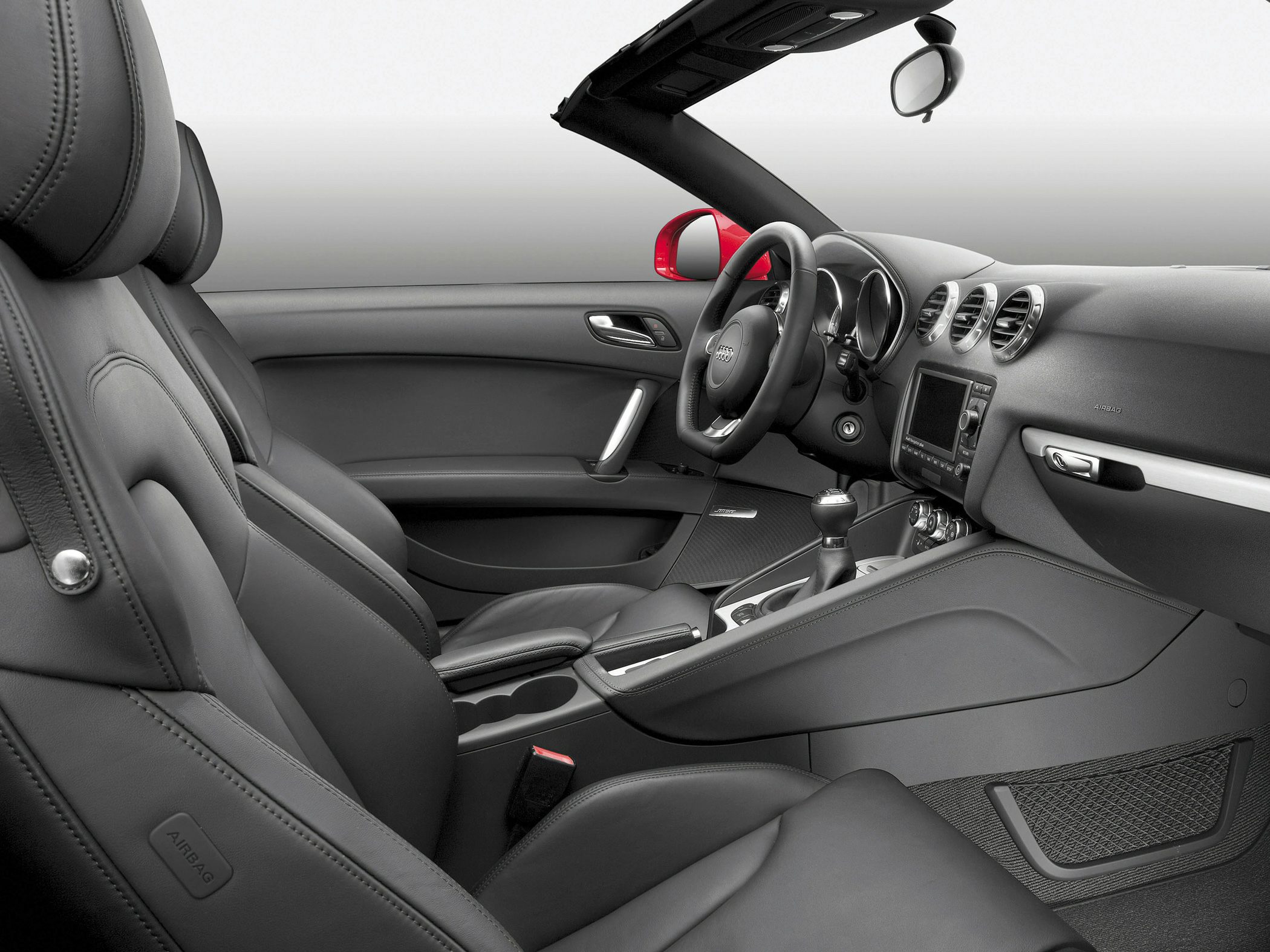 Leather seats and modern dashboard with steering wheel