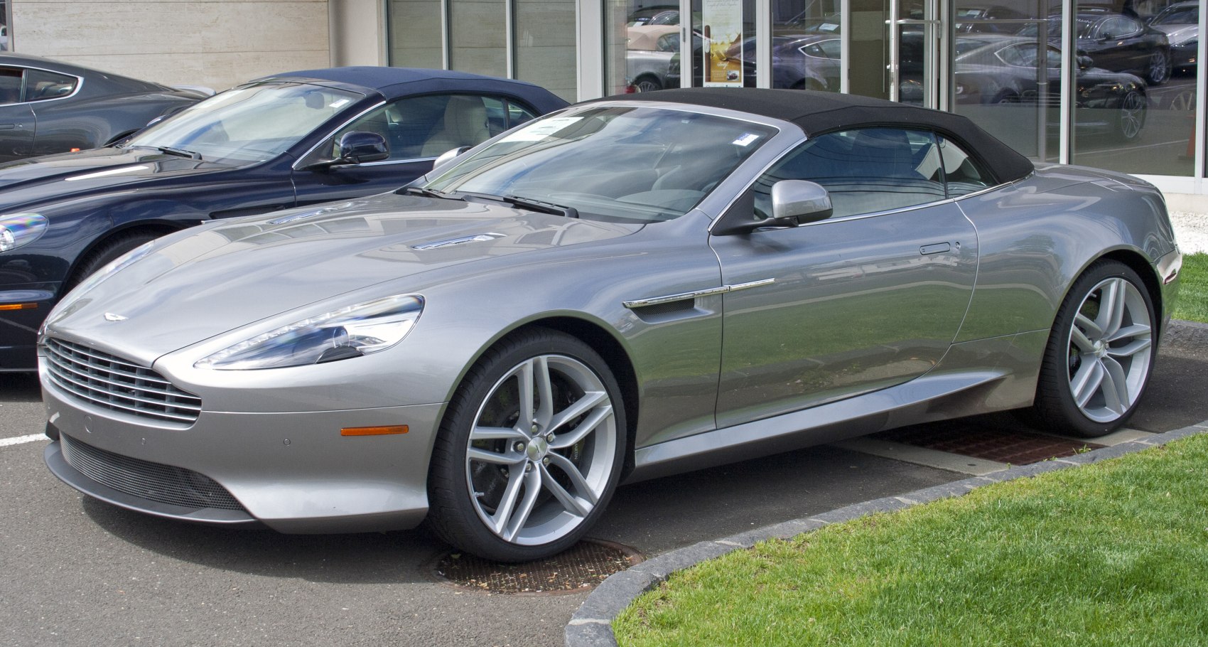Convertible with soft top and modern alloy wheels, front-side view