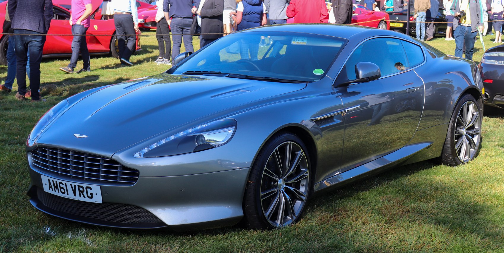 Luxury coupe with sleek front-side design and aggressive grille