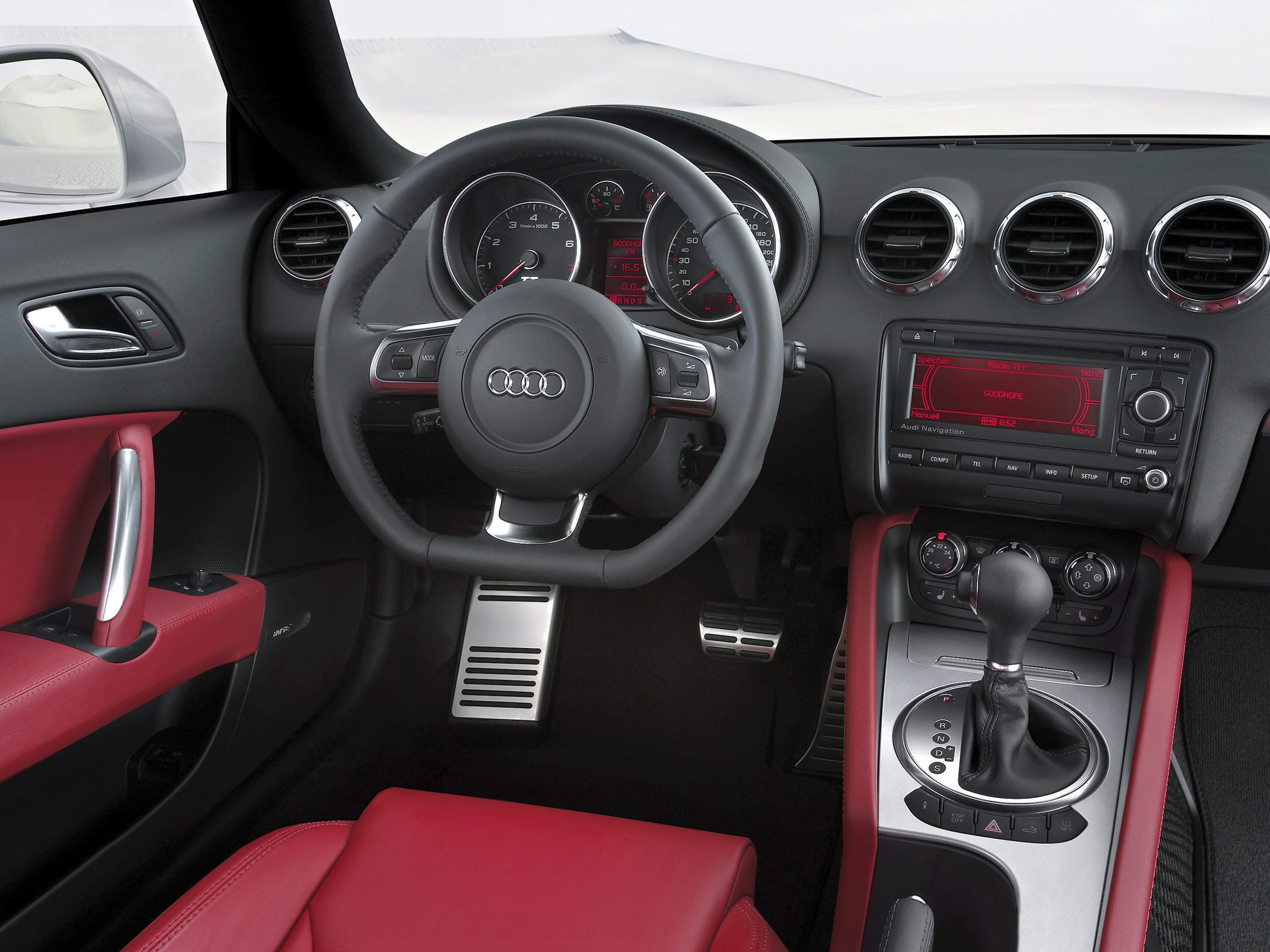 Steering wheel, dashboard, gear lever, red leather seats