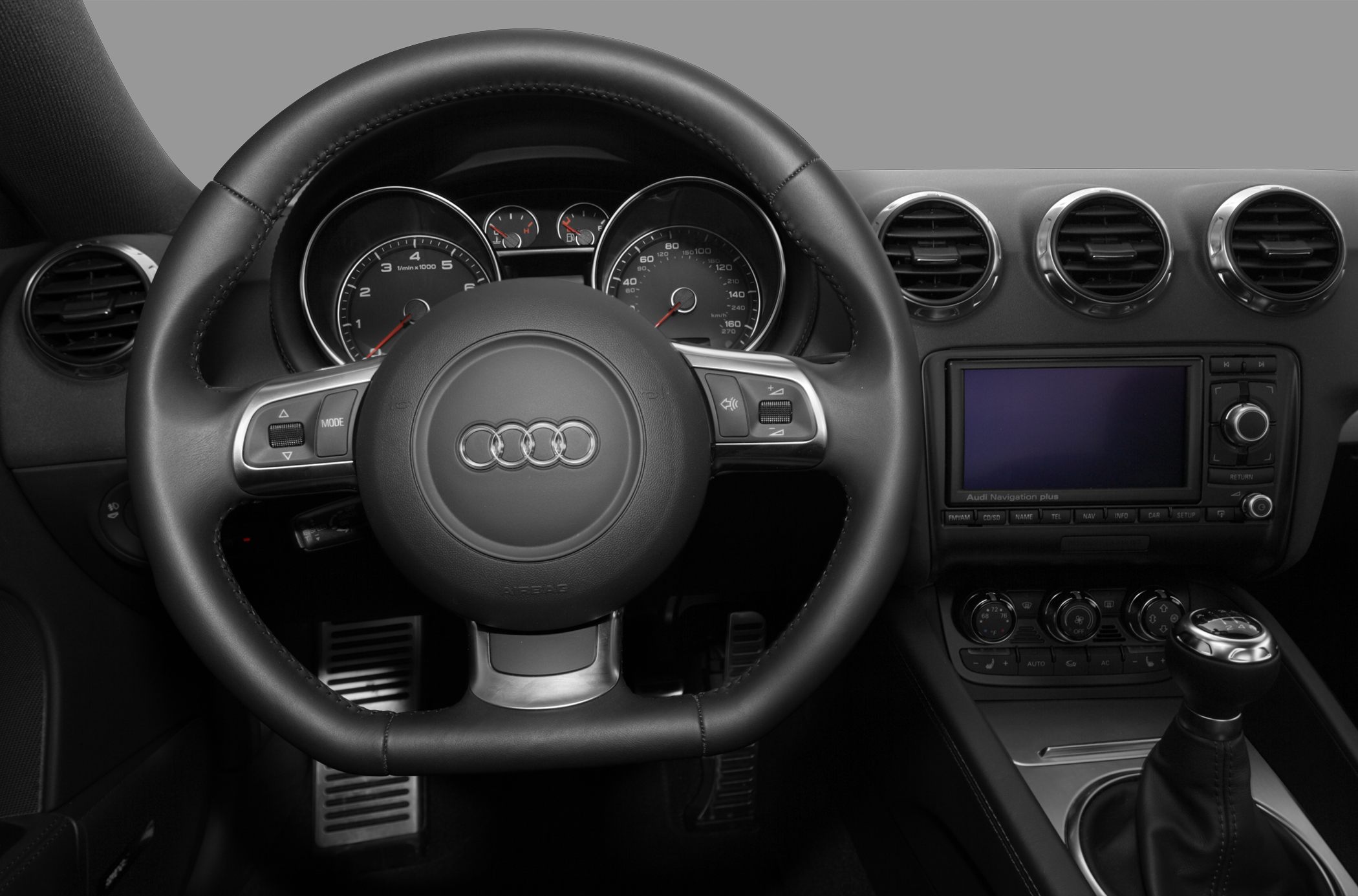 Steering wheel, dashboard, navigation screen, and manual gear shifter