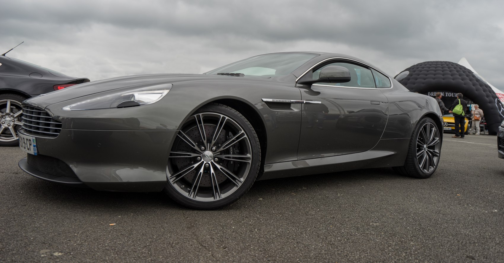 Front side view with sleek body lines and alloy wheels