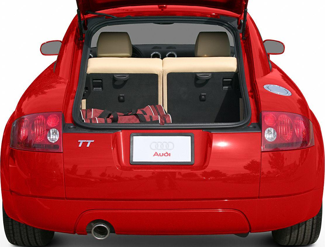 Rear view of hatchback with open trunk and taillights