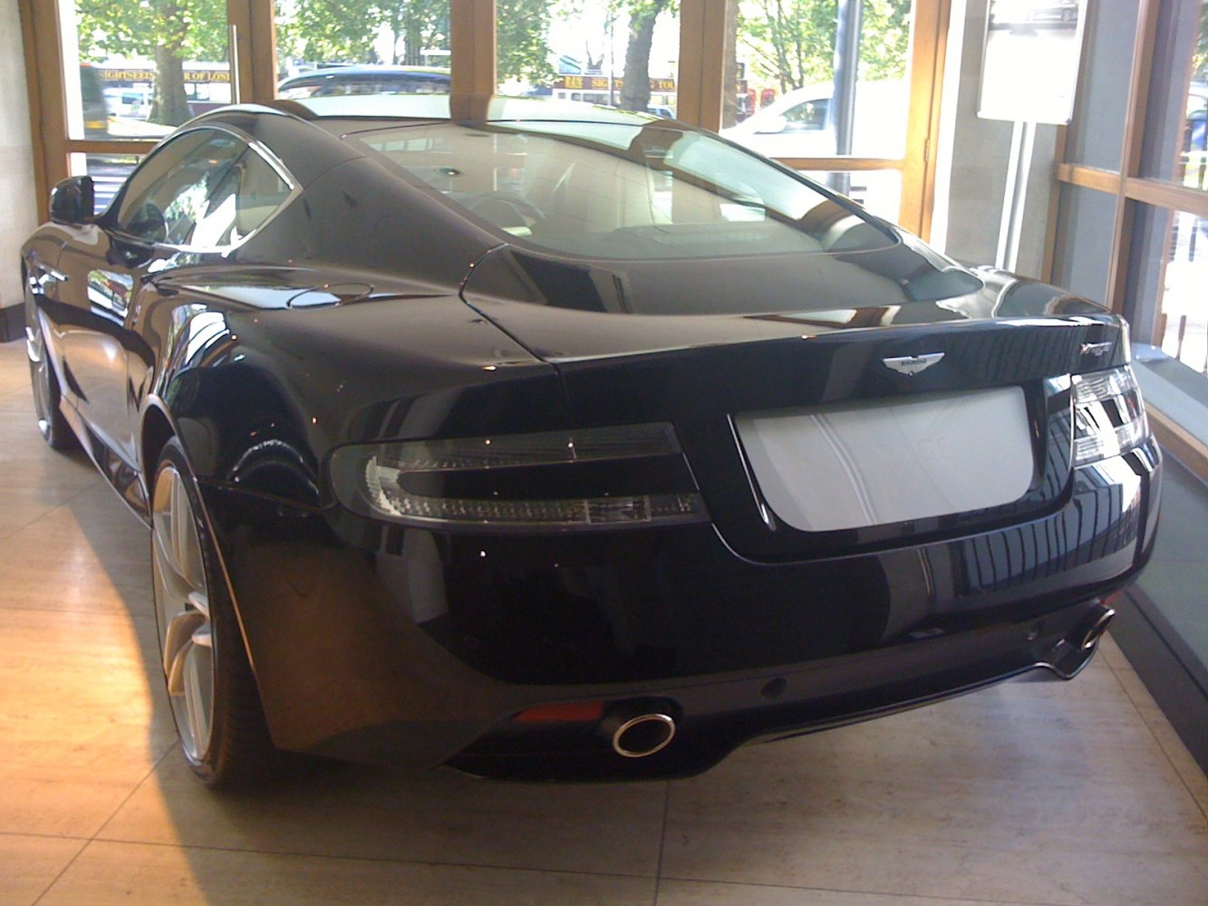 Rear view of a luxury coupe with sleek taillights and exhaust pipe