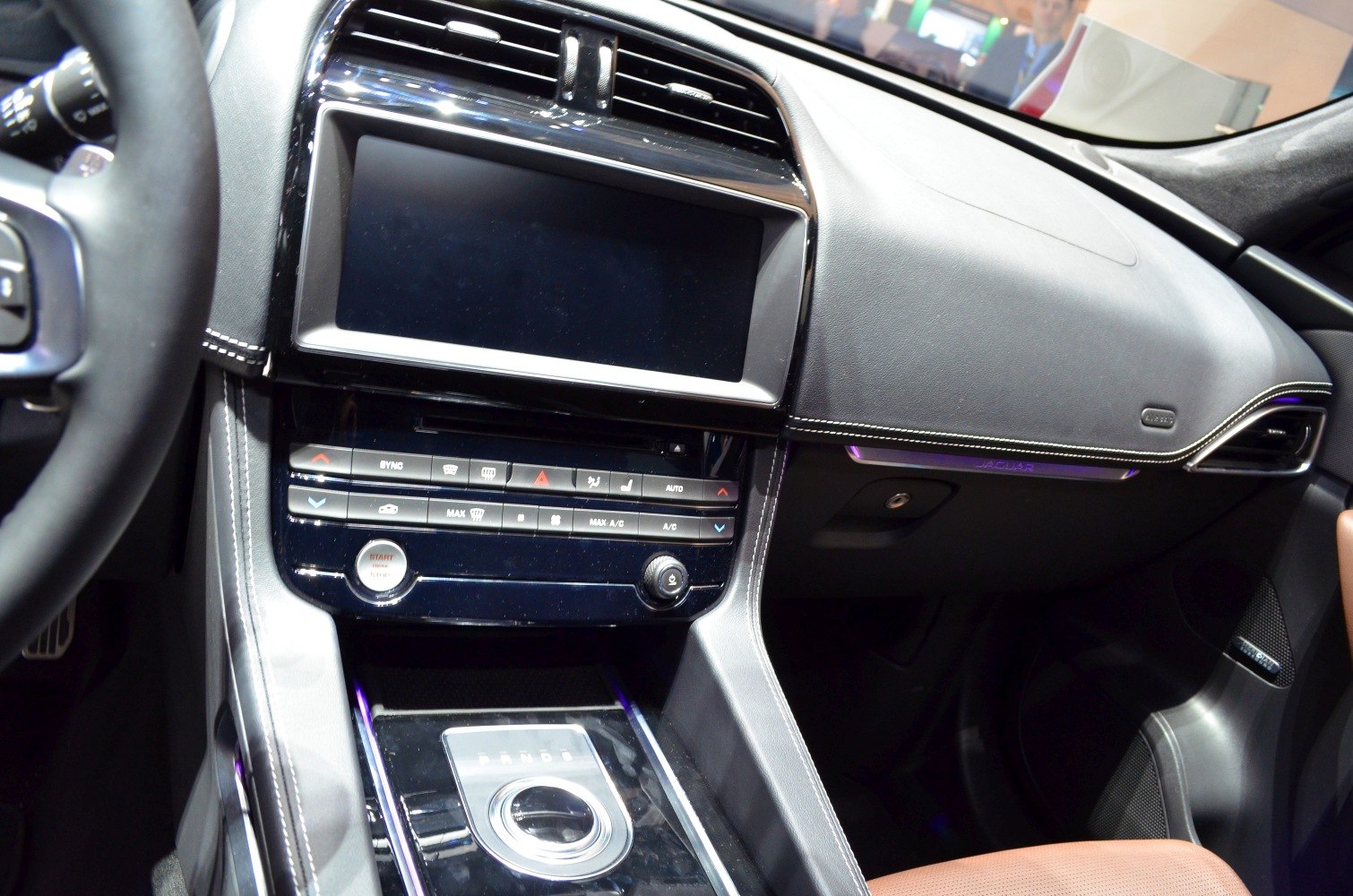 Modern interior dashboard and center console with rotary gear selector