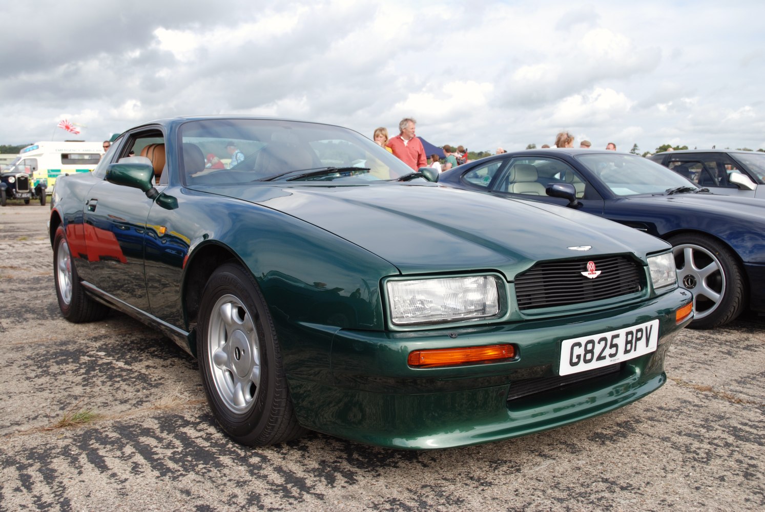 Green sport coupe with rectangular headlights and aerodynamic front
