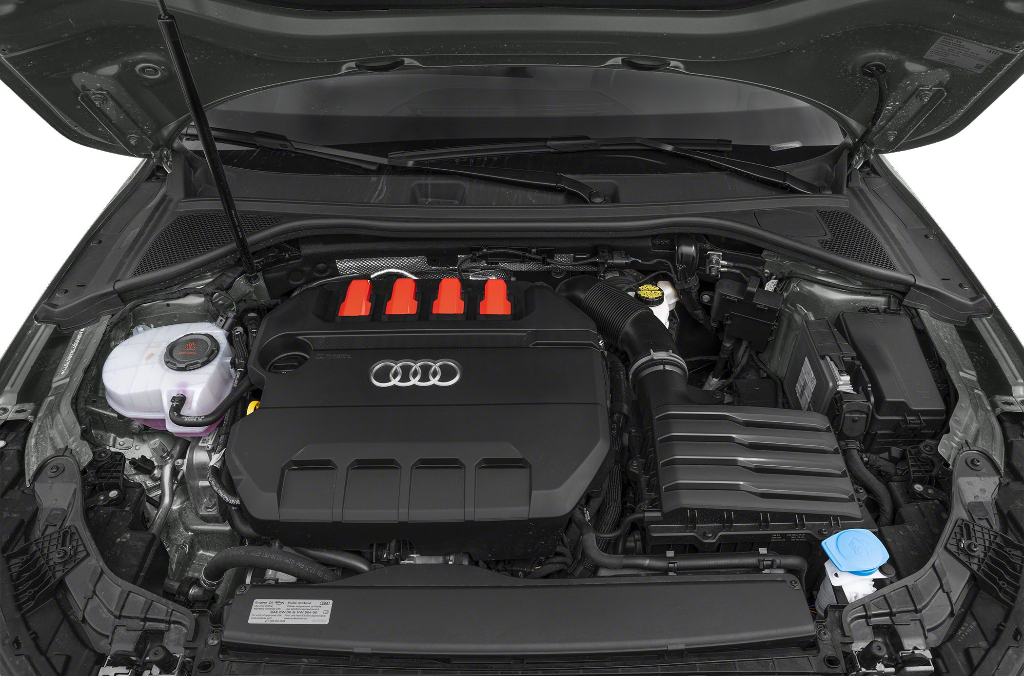 Close-up of engine compartment with black cover and red accents