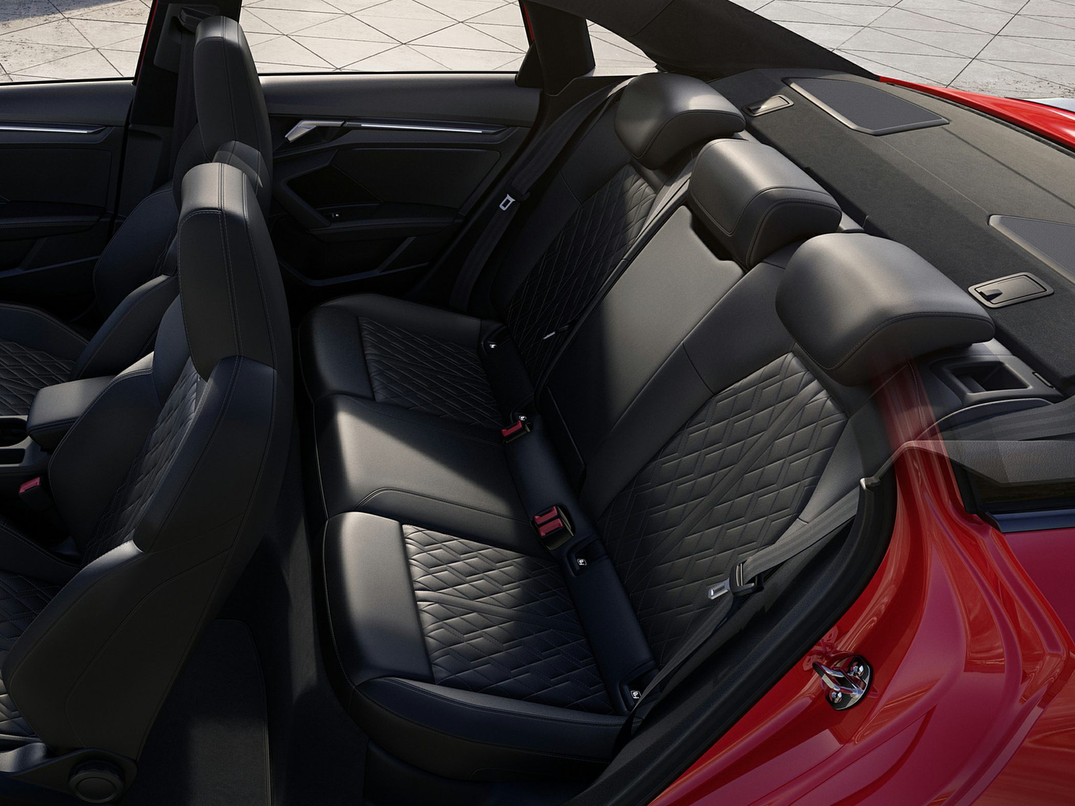Rear leather seats with diamond stitching and headrests