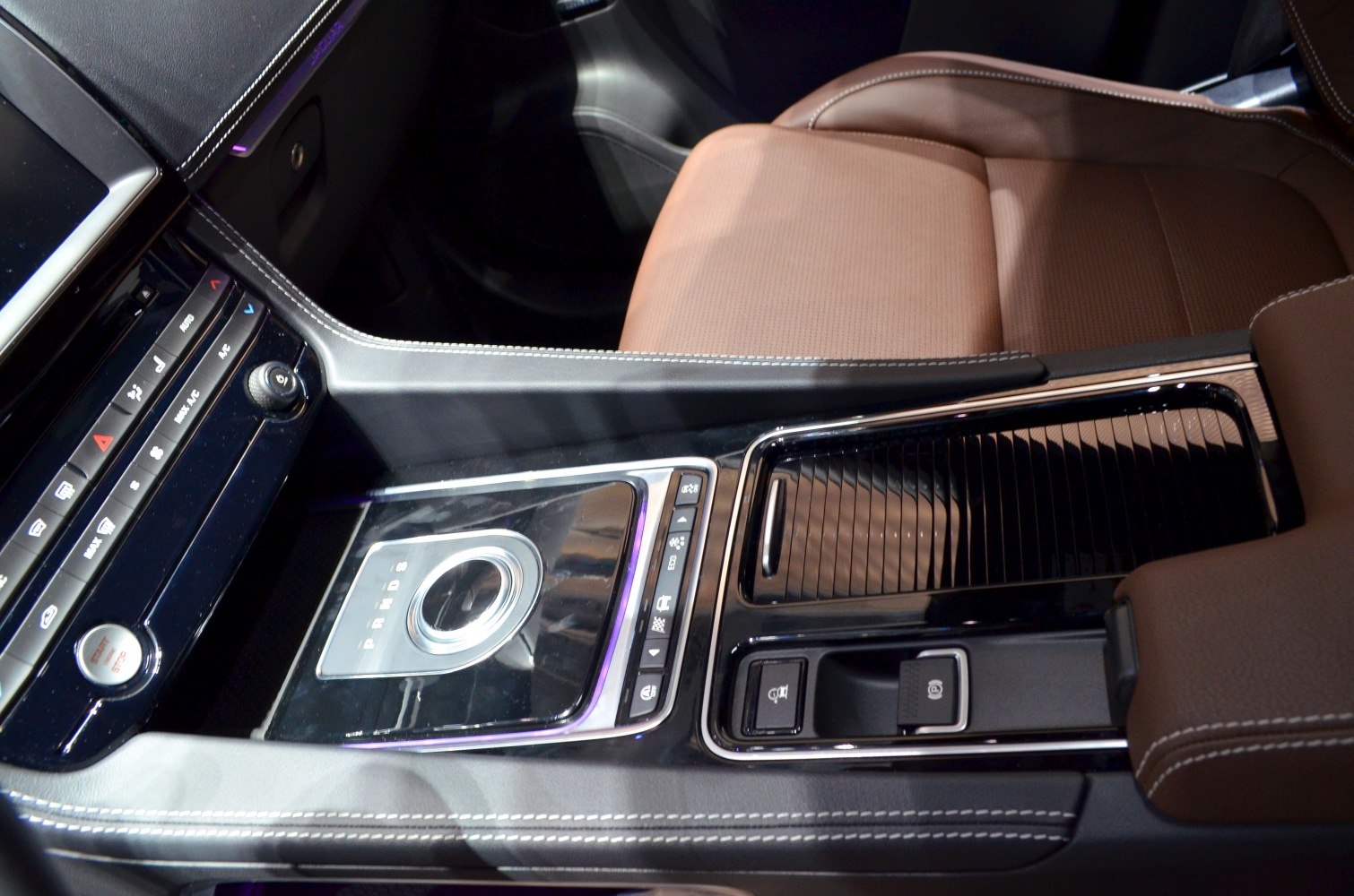 Luxury center console with rotary gear selector and ambient lighting