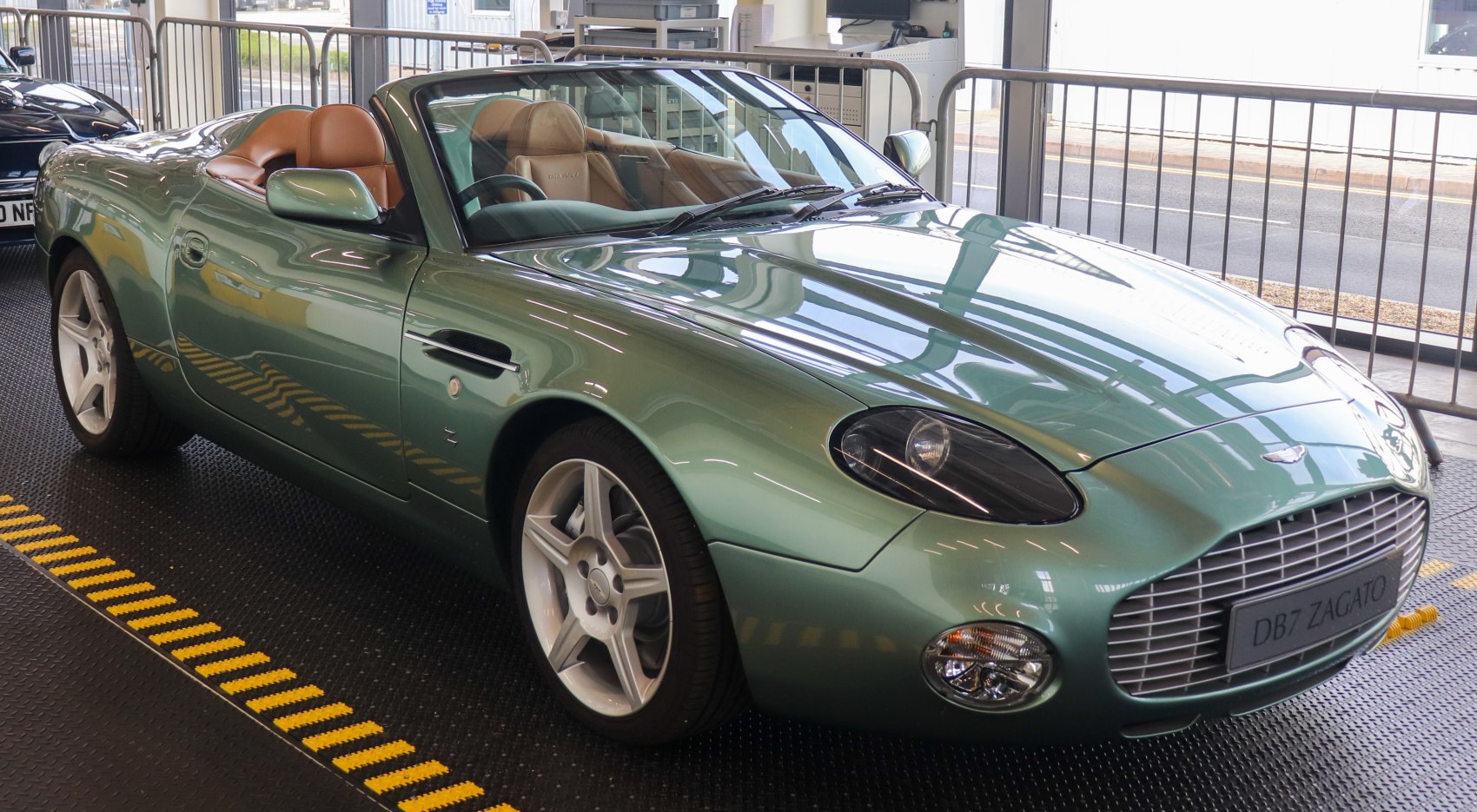 Convertible with prominent front grille and alloy wheels