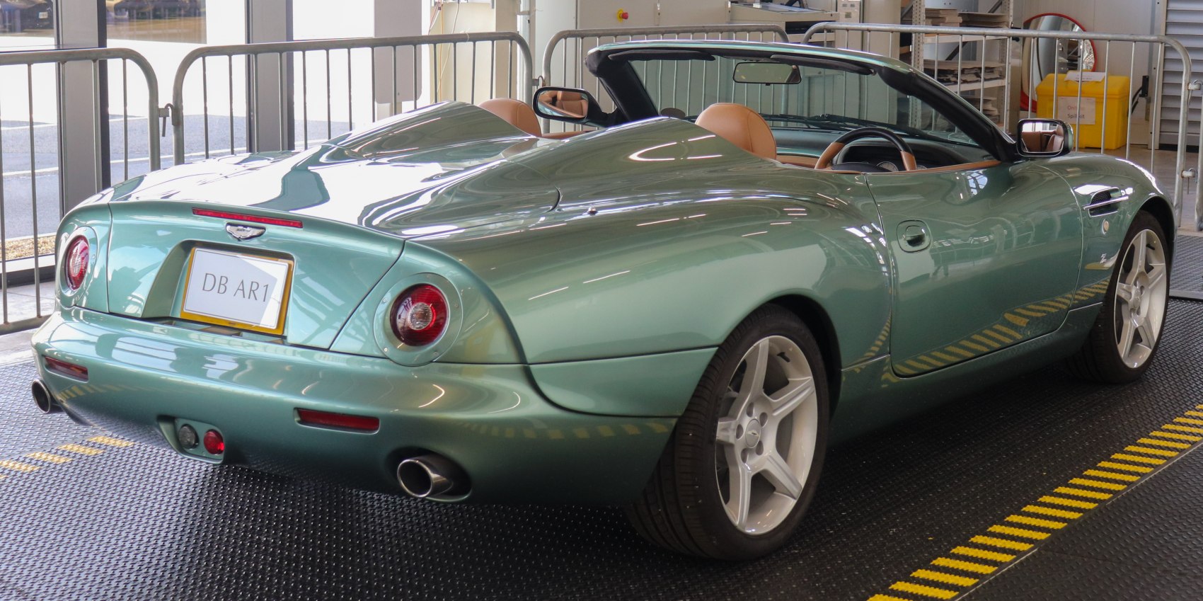 Convertible rear view with round taillights and sleek smooth body curves