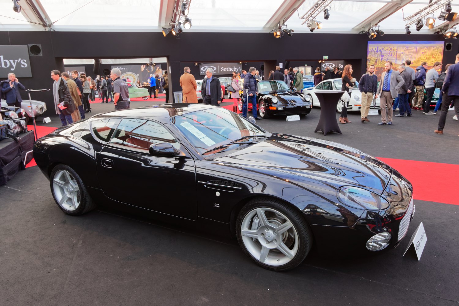 Sleek black sports coupe with unique body design and alloy wheels