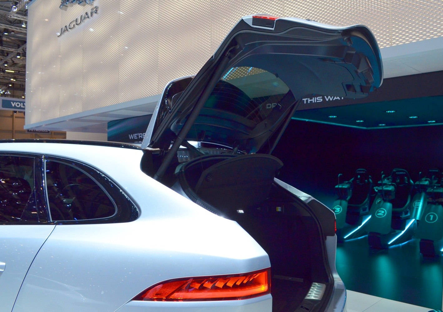 Rear hatch open with illuminated tail light on SUV