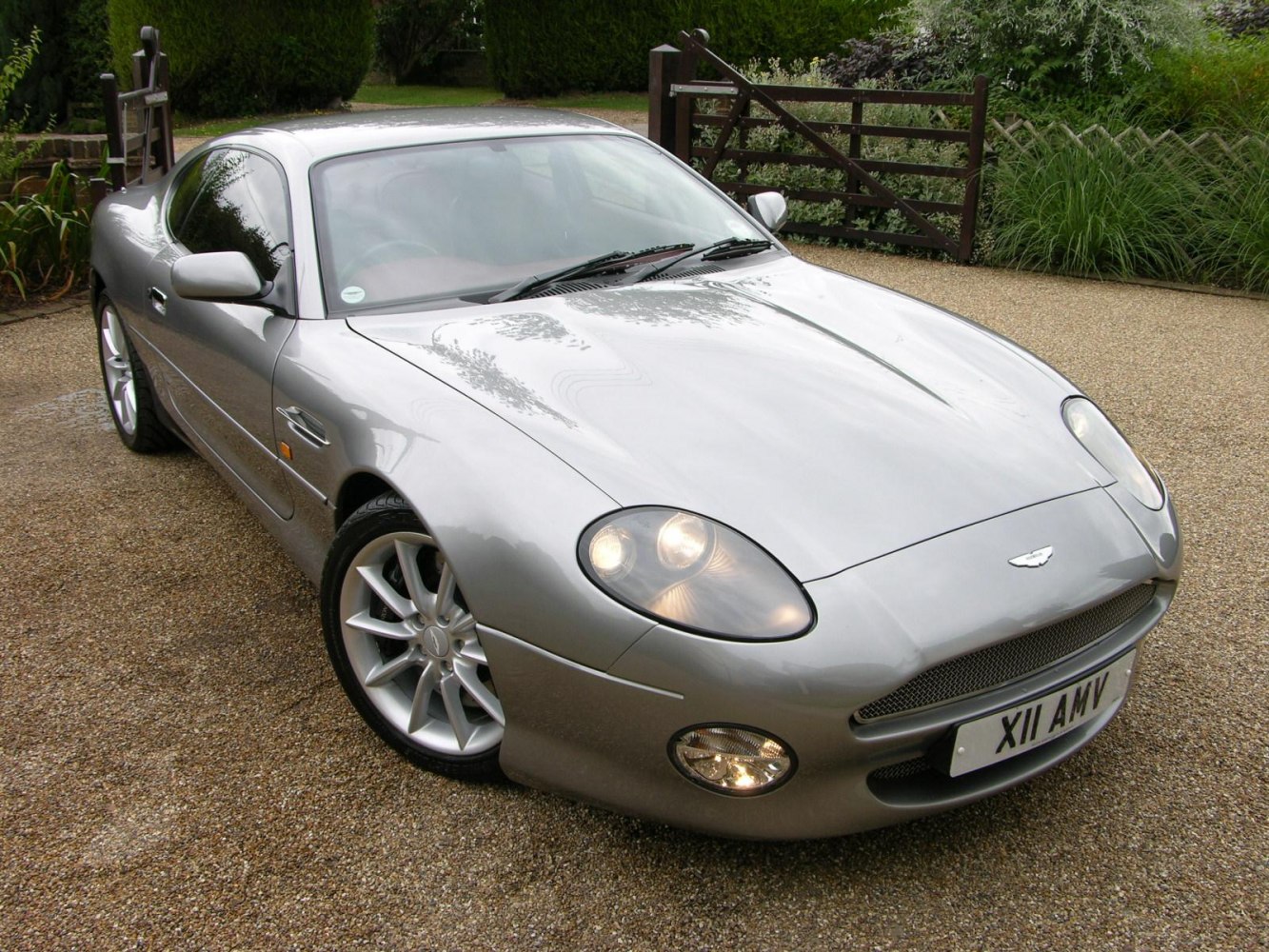 Front and side view of sleek coupe with oval headlights