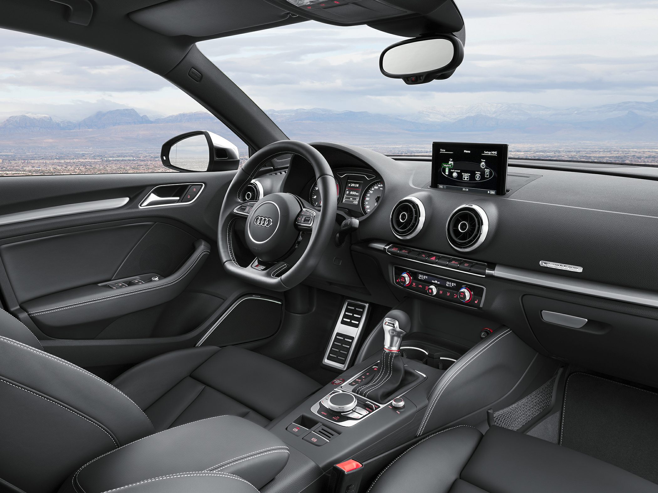 Cockpit view with dashboard, steering wheel, and infotainment screen