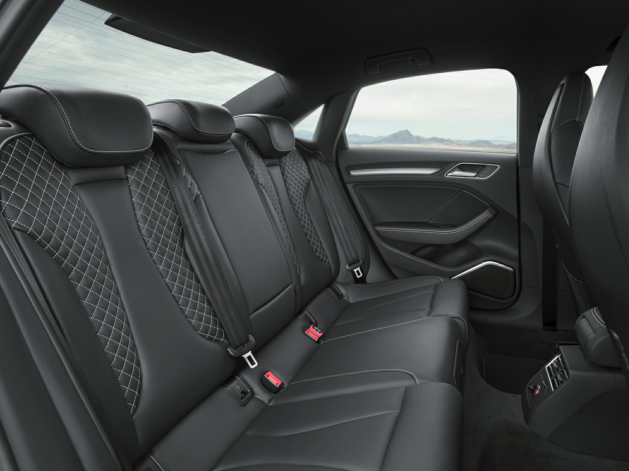 Luxury rear leather seats with diamond stitching and spacious legroom