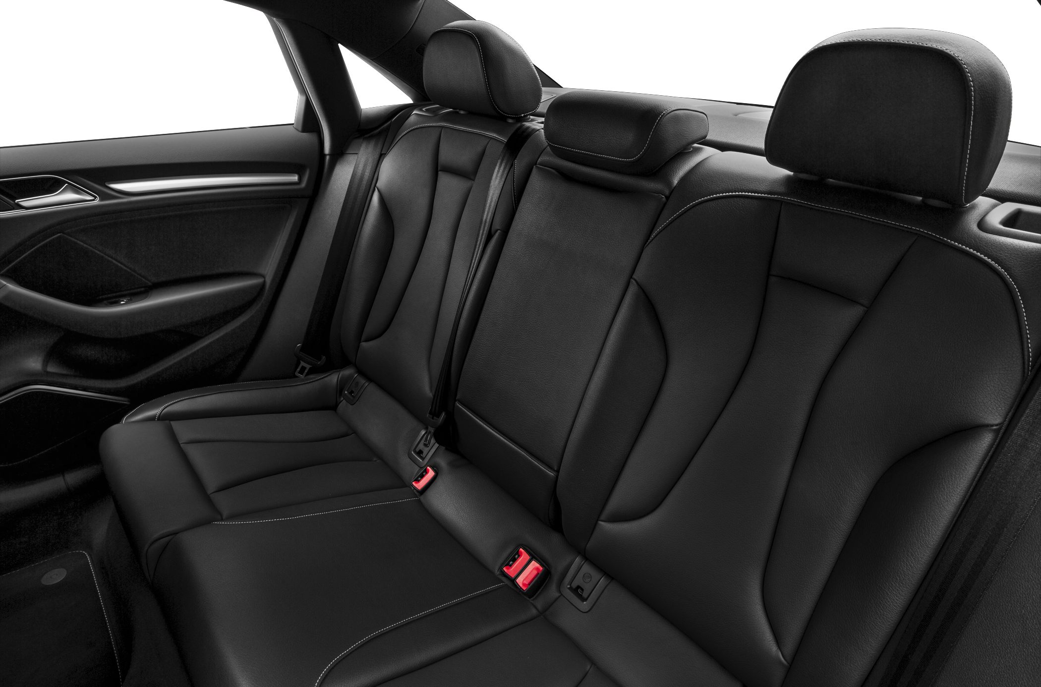 Black leather rear seats with headrests and seatbelts in a sedan interior