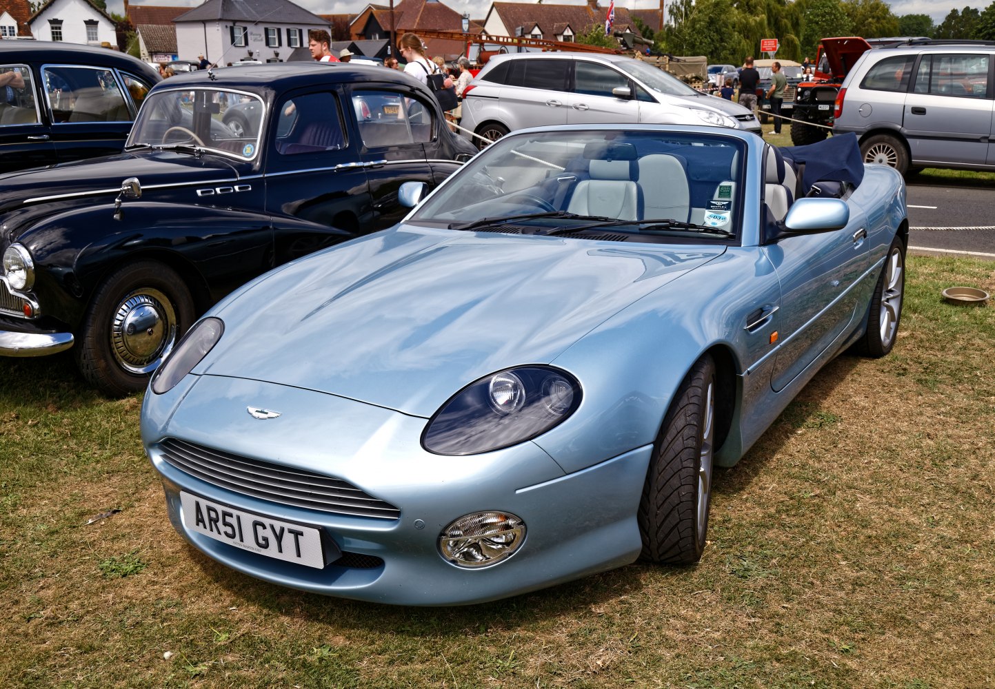 Light blue convertible luxury sports car with sleek aerodynamic design