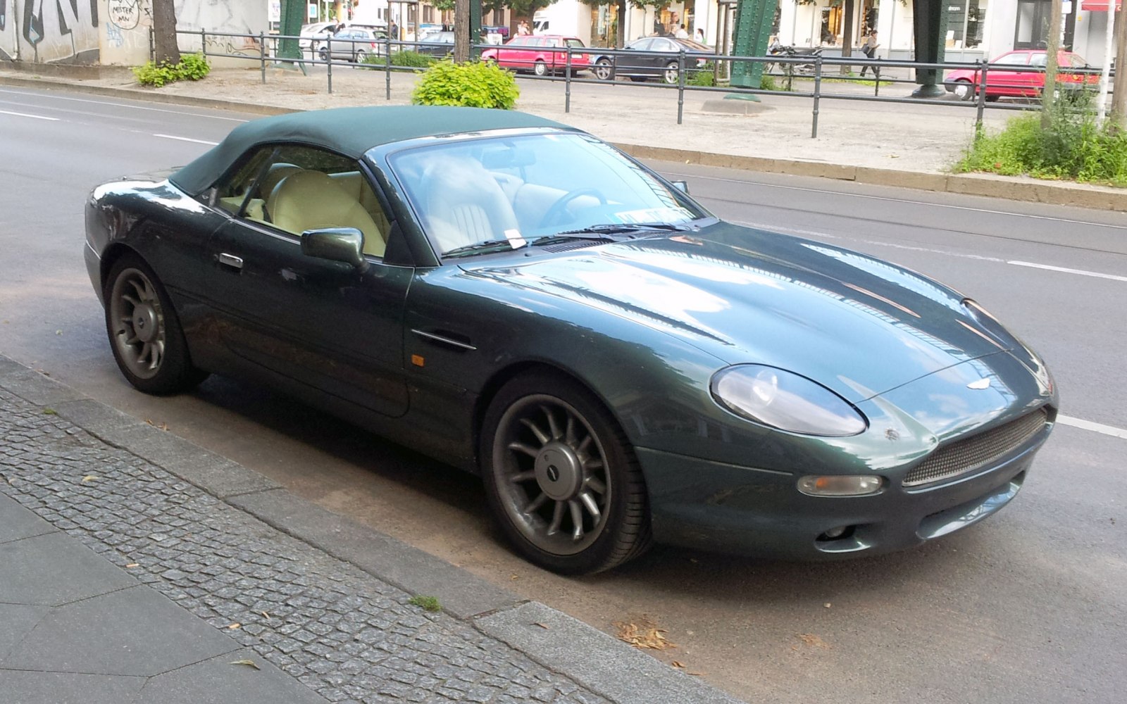 Convertible luxury sports car with smooth aerodynamic design and soft roof