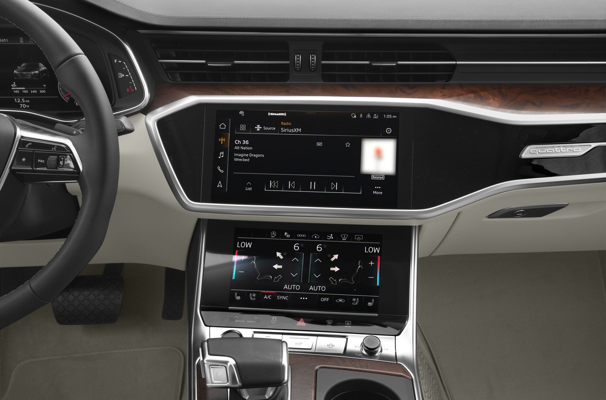 Dual touchscreen infotainment and climate control system with luxury interior trim