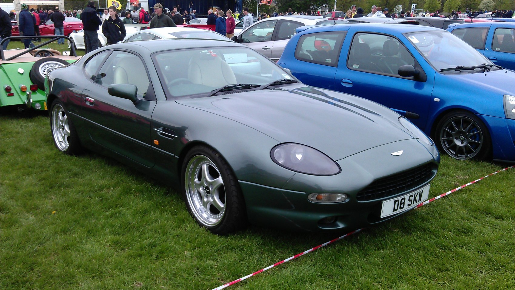 Sleek coupe with smooth body lines and distinctive front headlights.