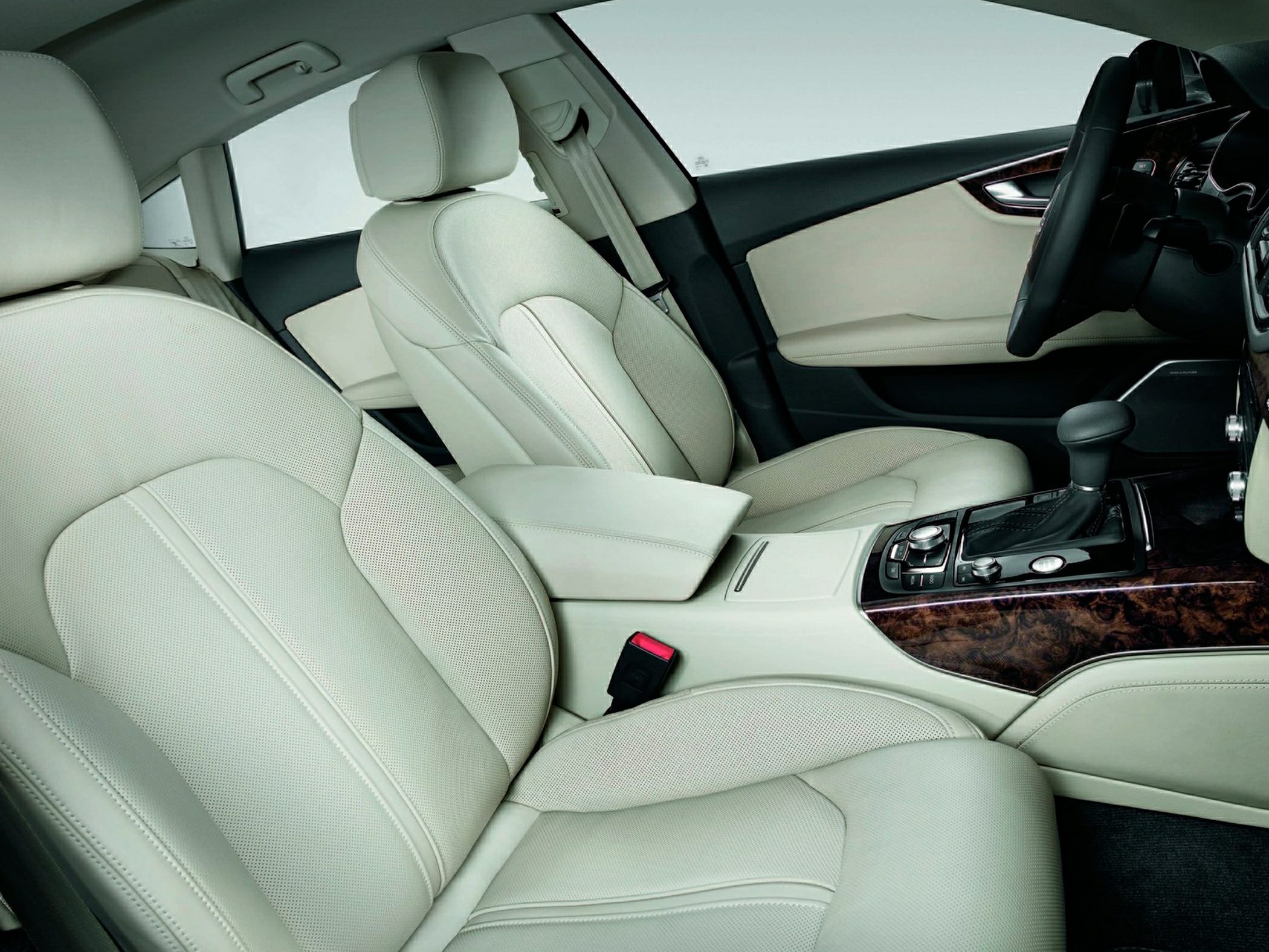 Beige leather seats and wooden trim on center console and doors