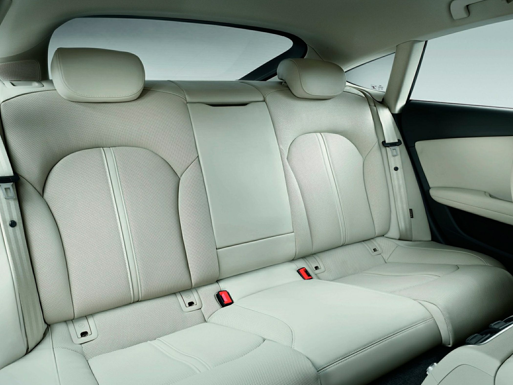 Beige leather rear seats with headrests and center armrest