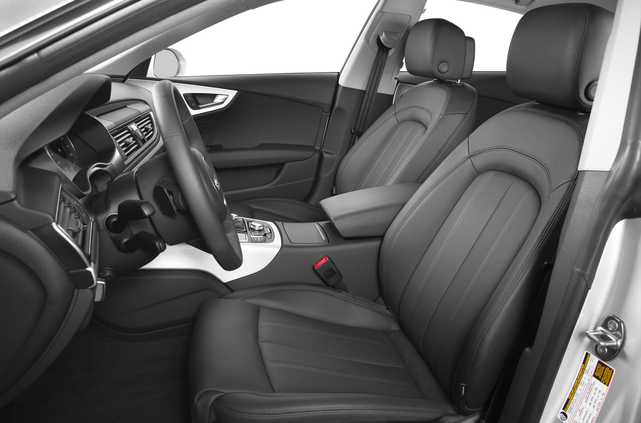 Leather front seats and modern dashboard with steering wheel