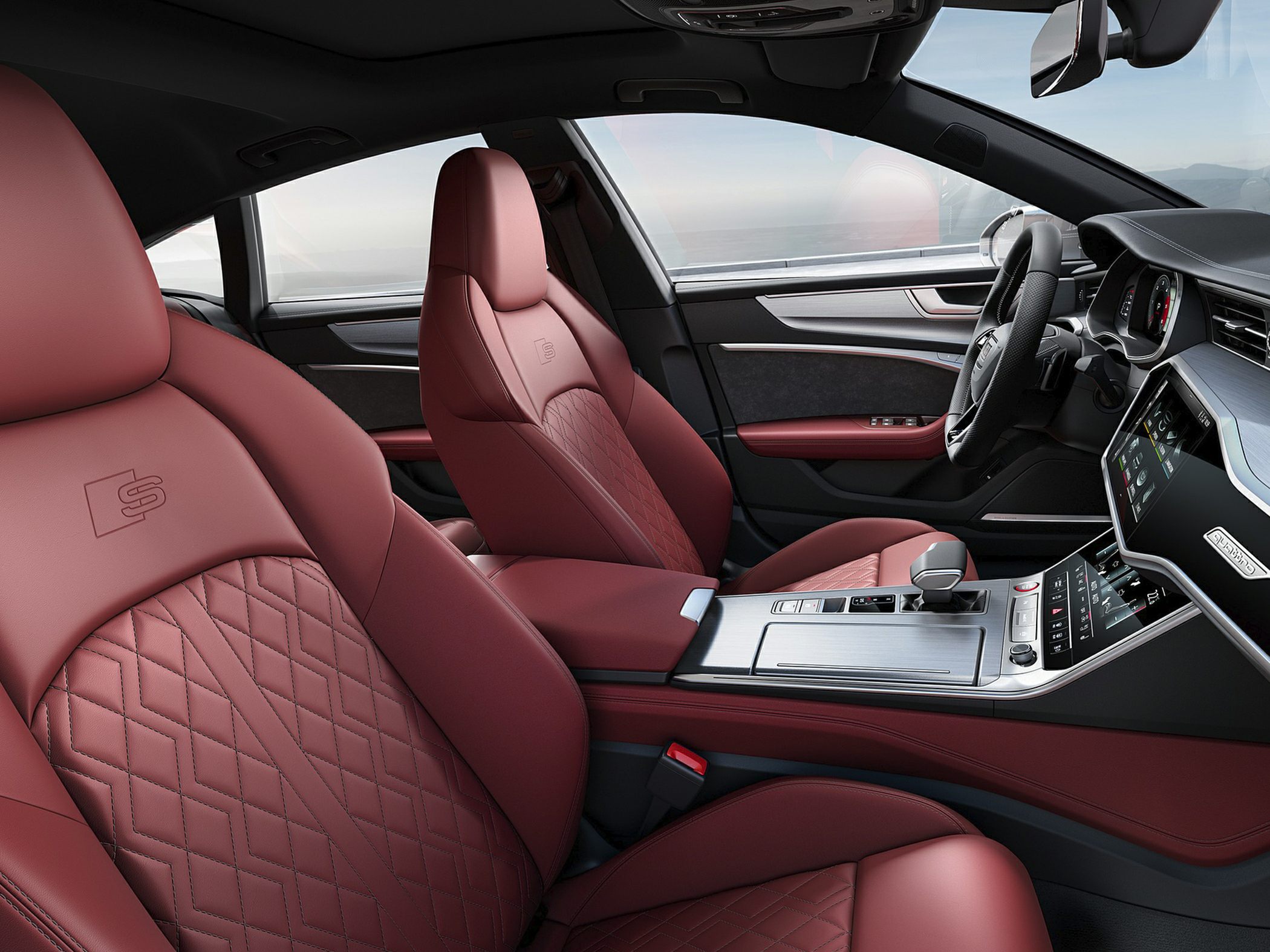 Luxury quilted red leather front seats and modern dashboard