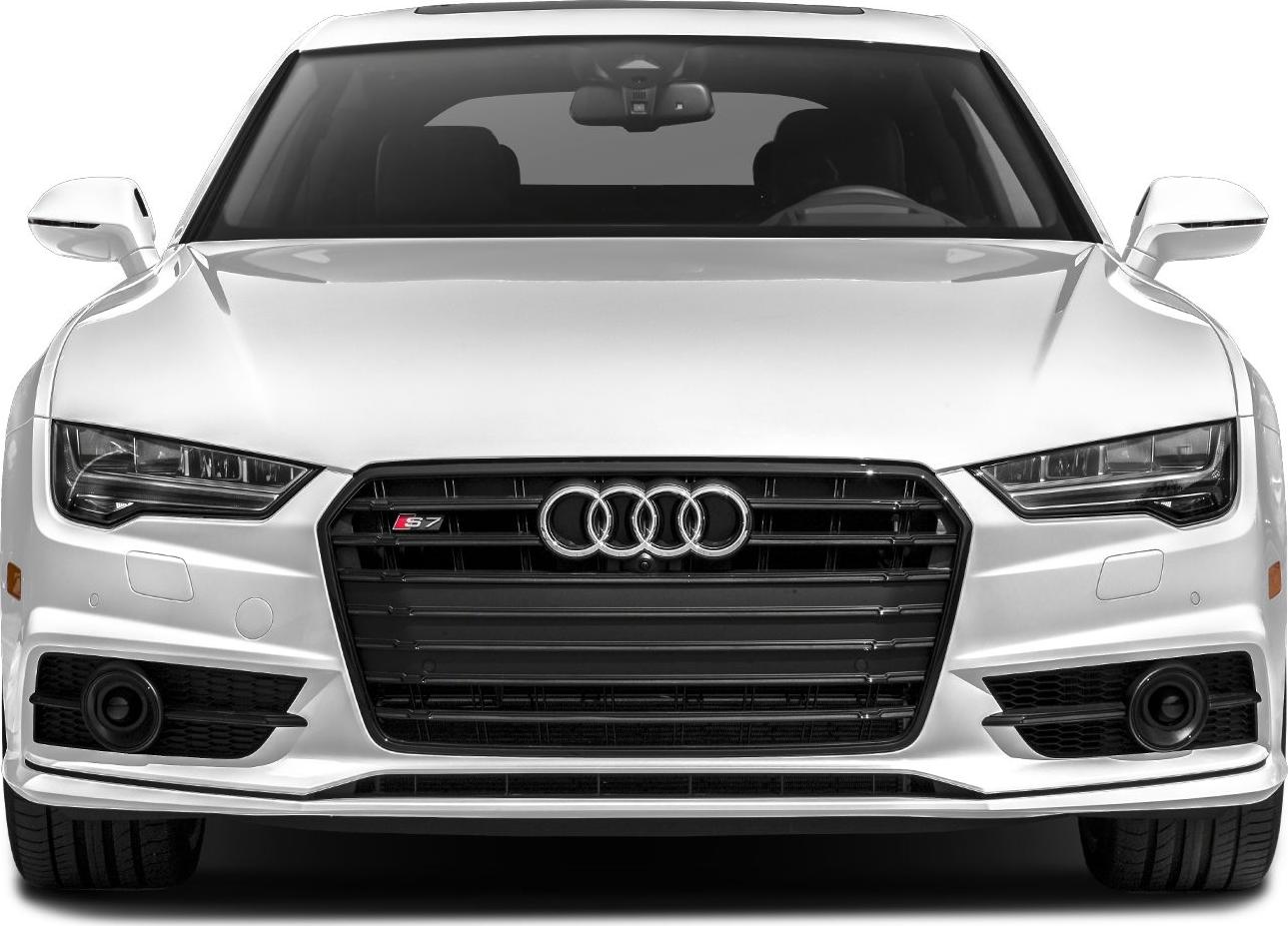 Close-up front view of car grille, headlights, and side mirrors.