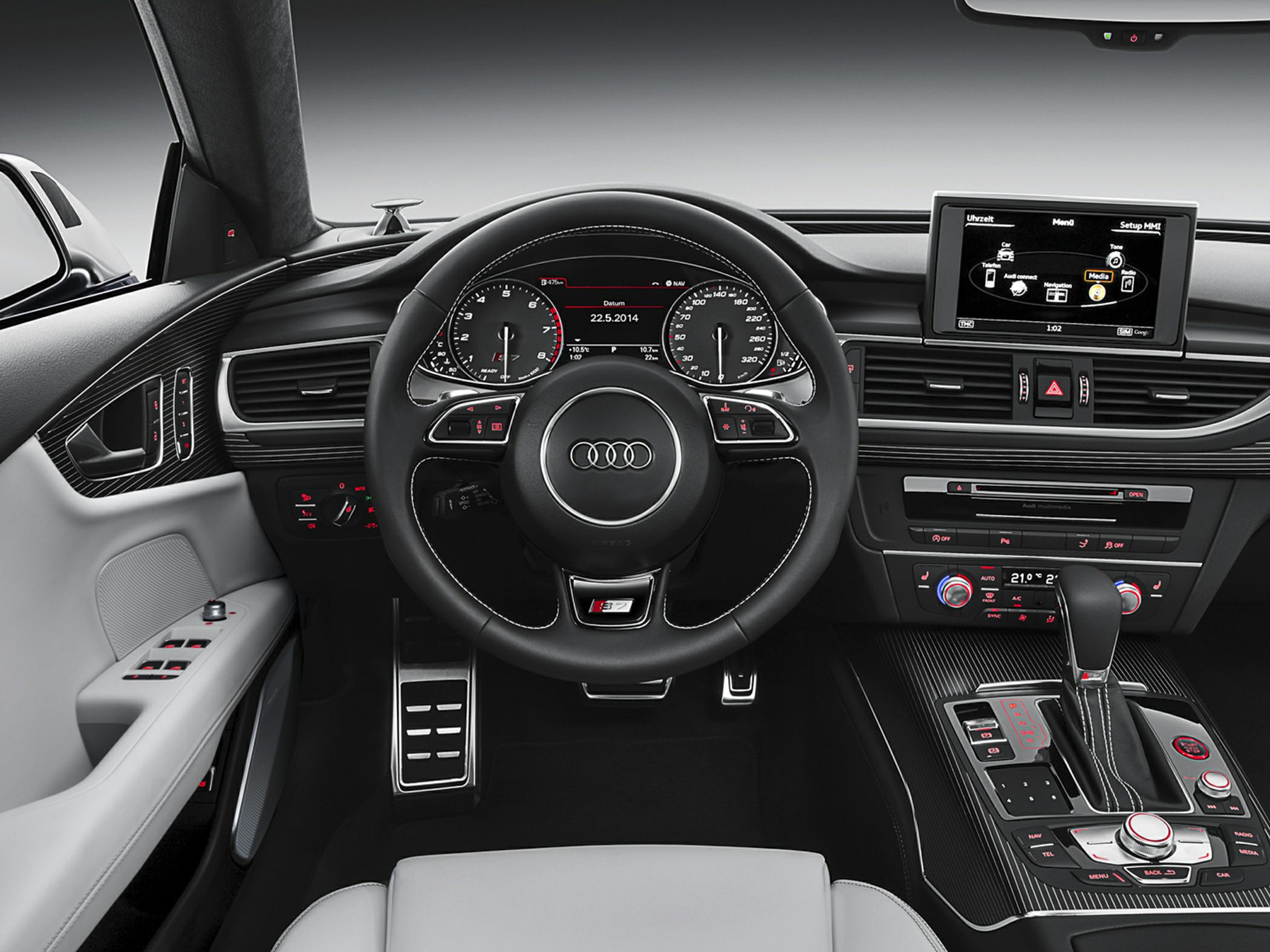 Luxury car interior with digital dashboard and multifunction steering wheel