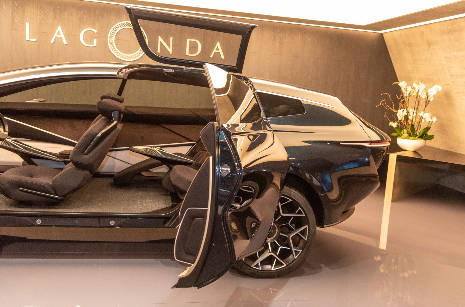 Futuristic rear-hinged doors and luxury interior seating with modern wheel design