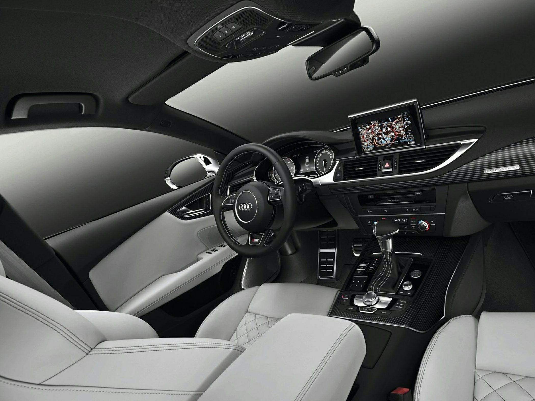 Luxury car interior with dashboard, steering wheel, and navigation display
