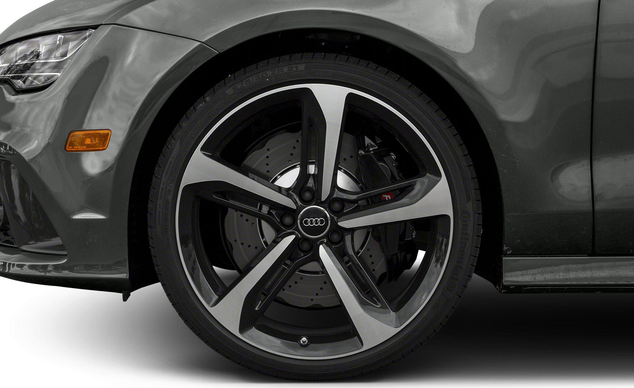 Close-up of 5-spoke alloy wheel with ventilated disc brake and caliper