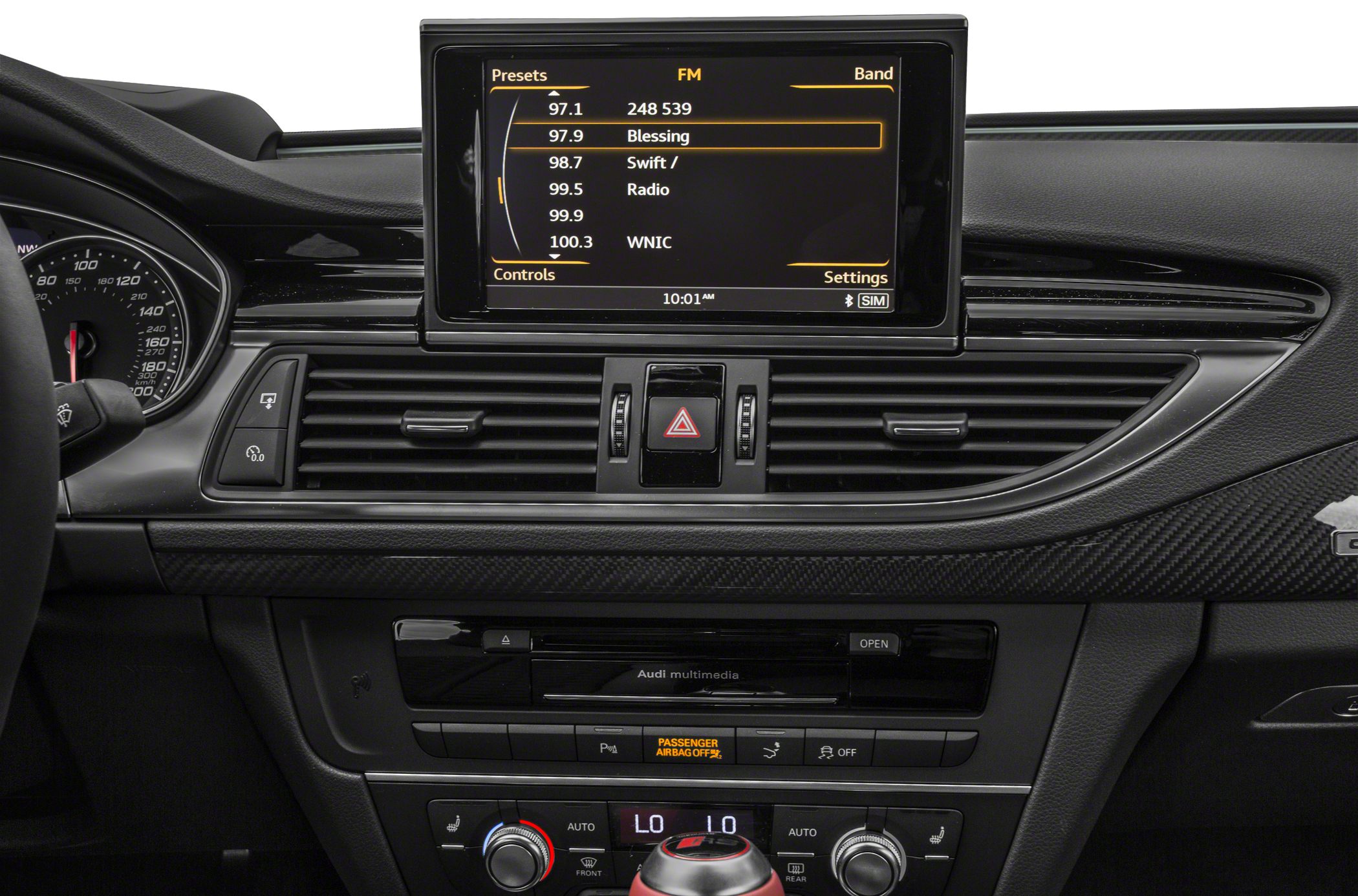 Car multimedia screen with radio presets and climate control panel with dual-zone settings.