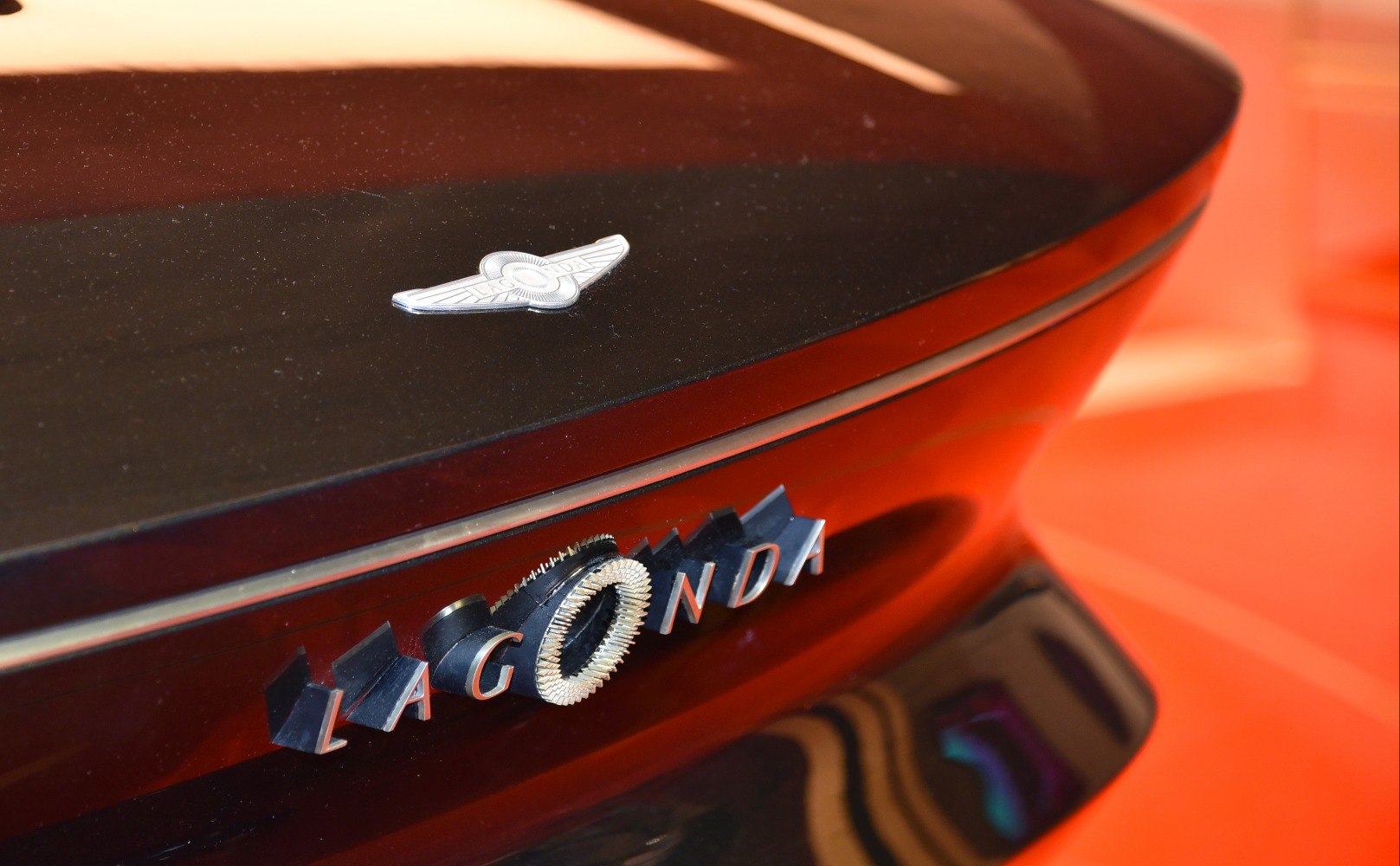 Rear emblem and Lagonda lettering on glossy surface