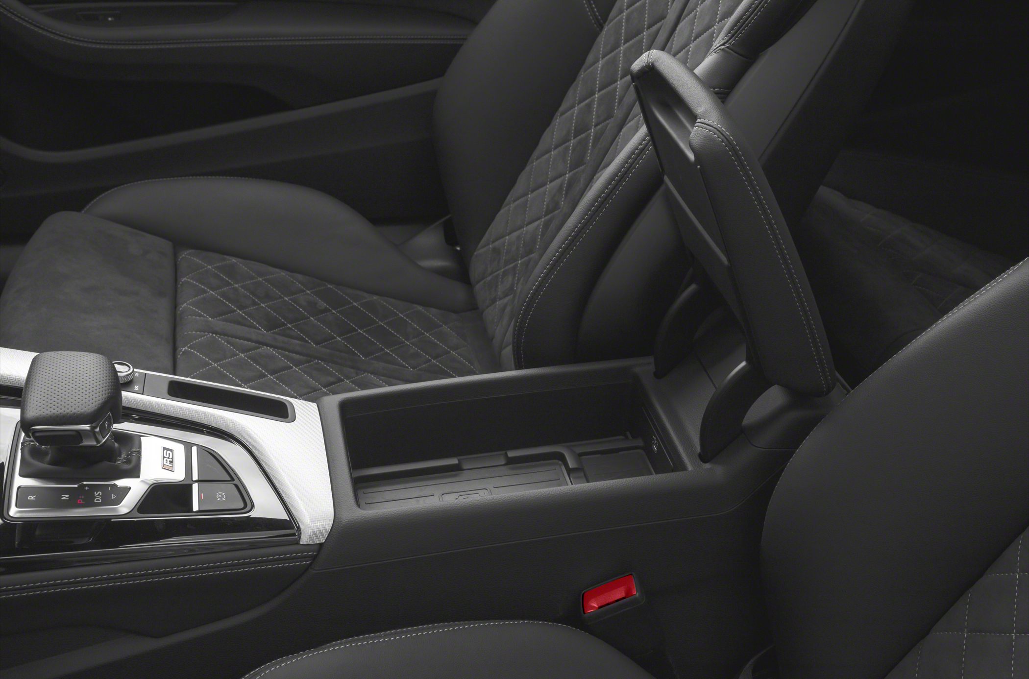Quilted leather seats and modern gear shifter in a luxury car interior