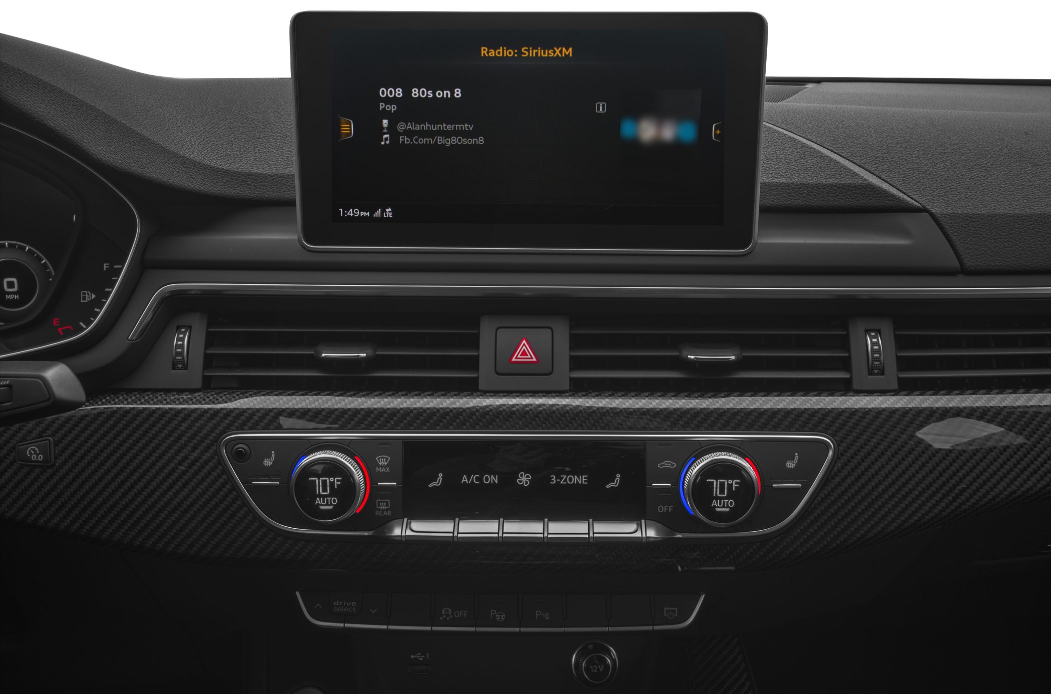 Carbon fiber dashboard with three-zone climate control and digital infotainment screen