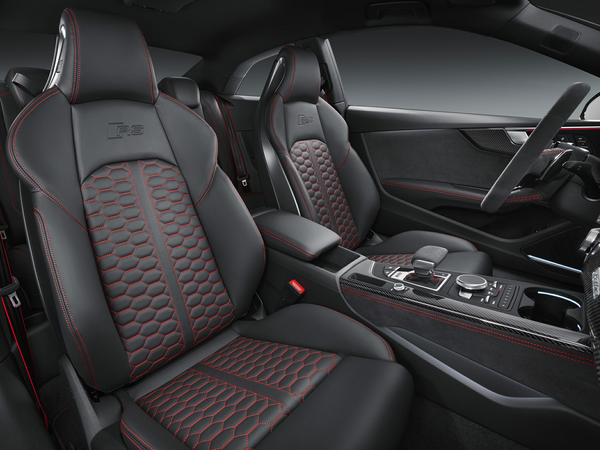 Sport seats with red contrast stitching and carbon fiber trim