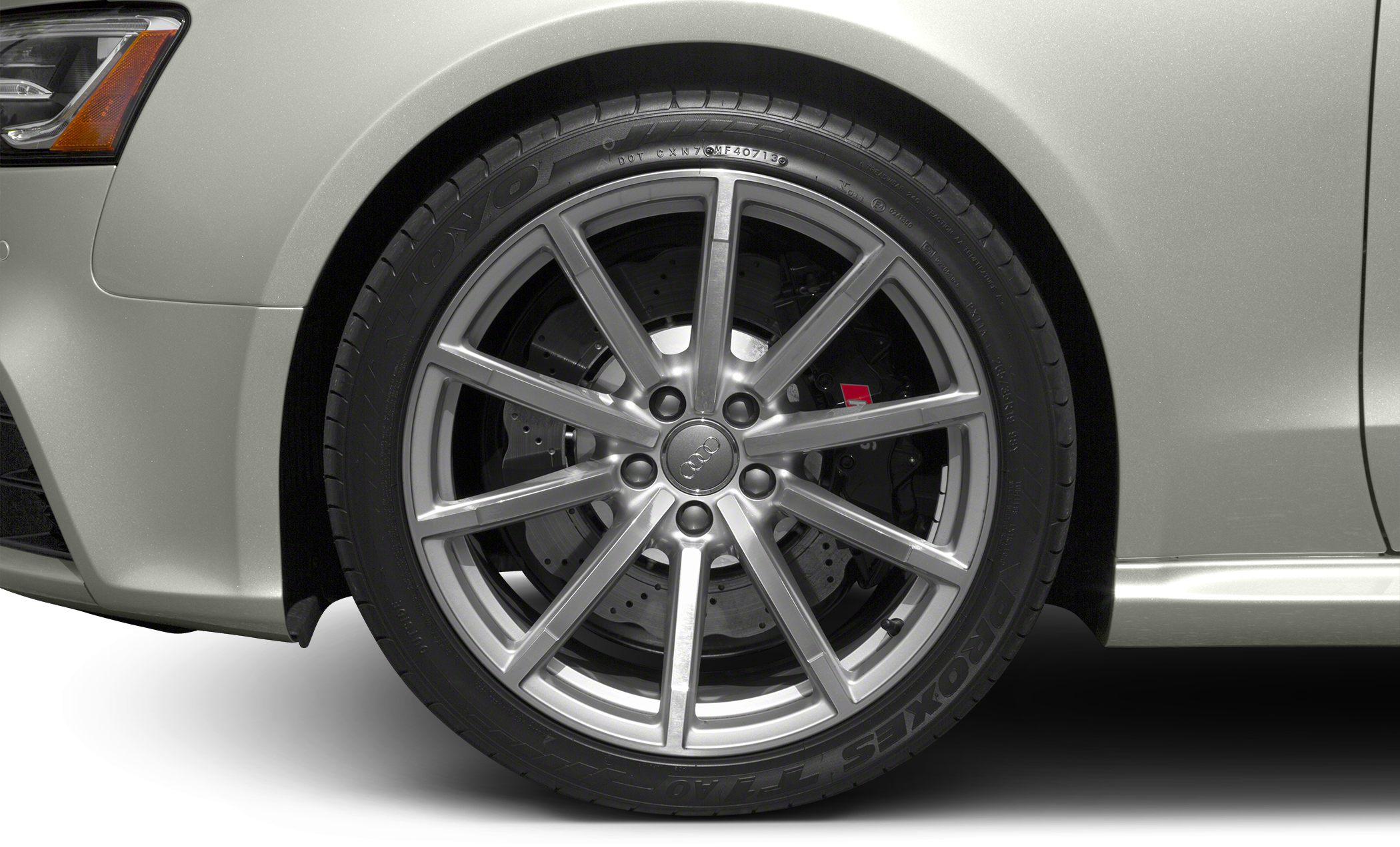 Close-up of a multi-spoke alloy wheel with brake disc and caliper.