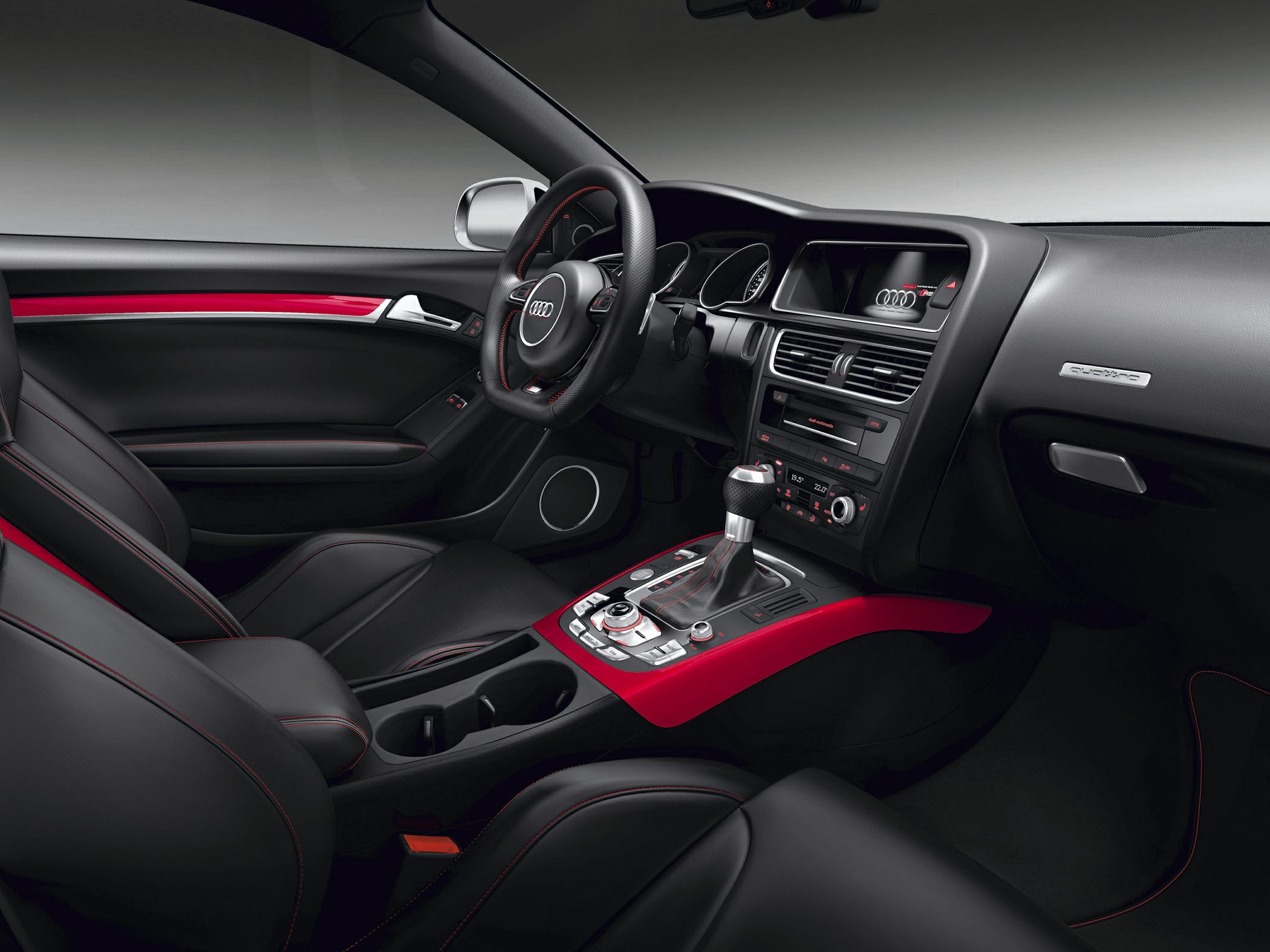 Luxury car interior with dashboard, steering wheel, and center console