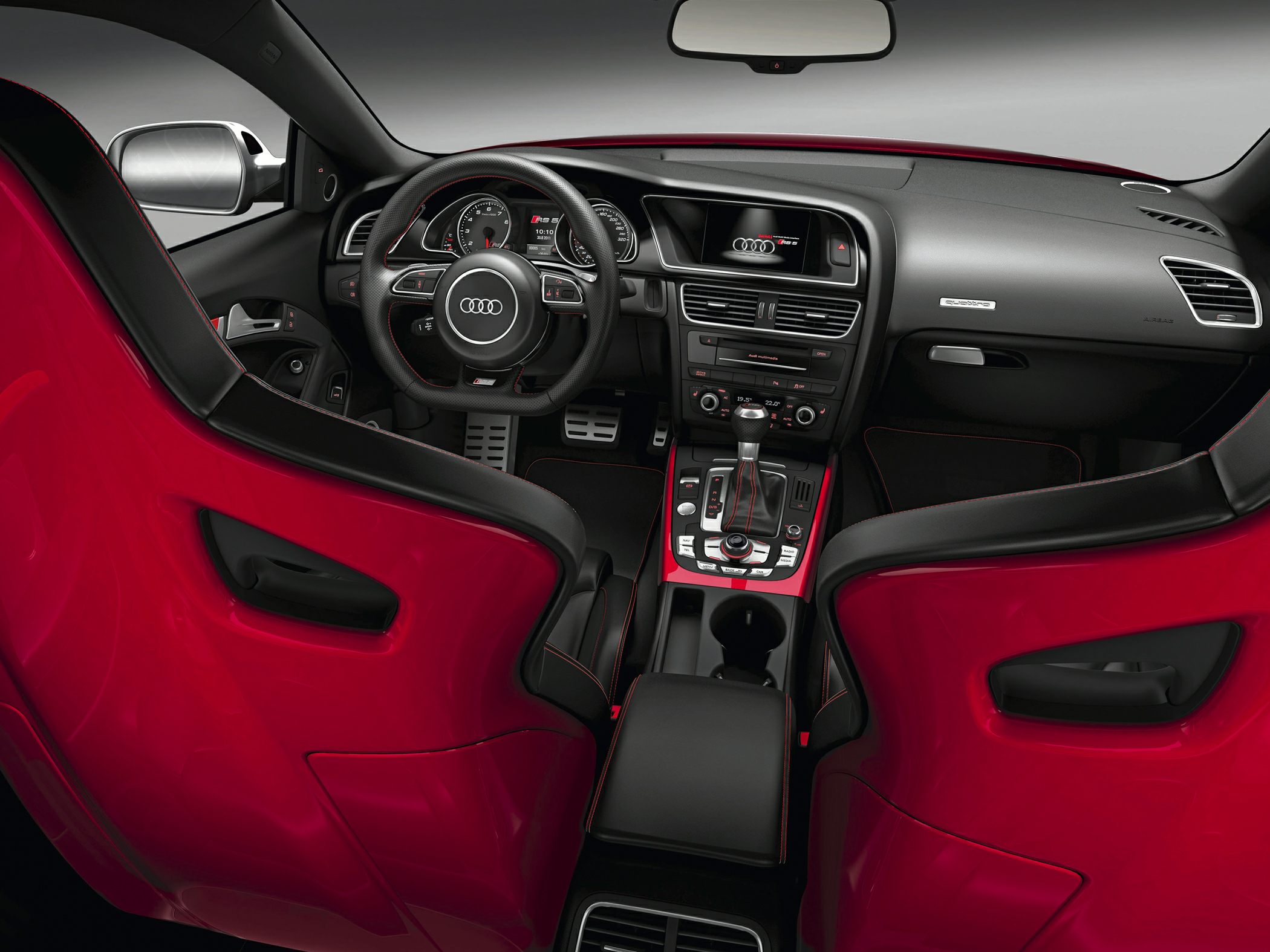 Sporty red seats with premium dashboard and controls