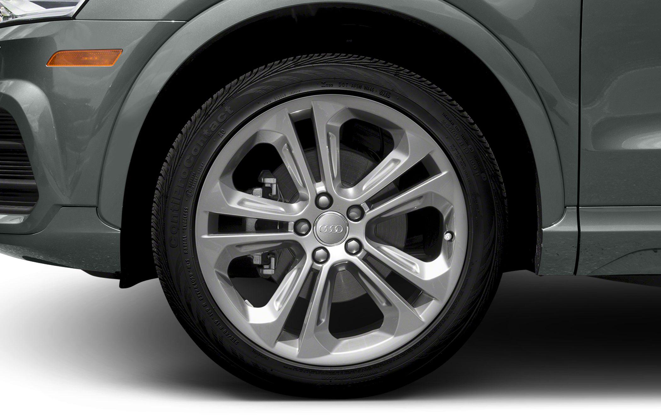 Close-up of alloy wheel and brake disc on SUV