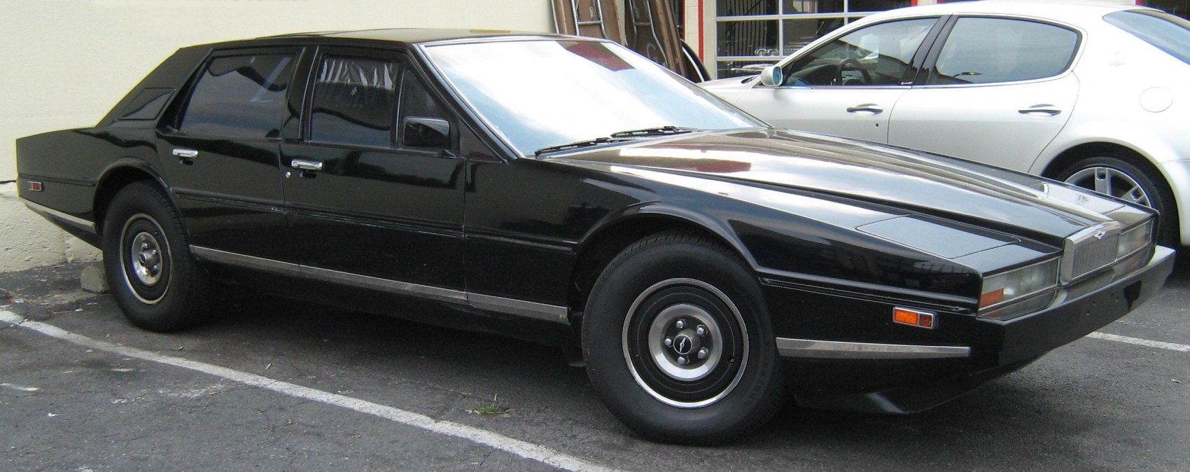 Sharp angular luxury sedan with pop-up headlights and unique wheels