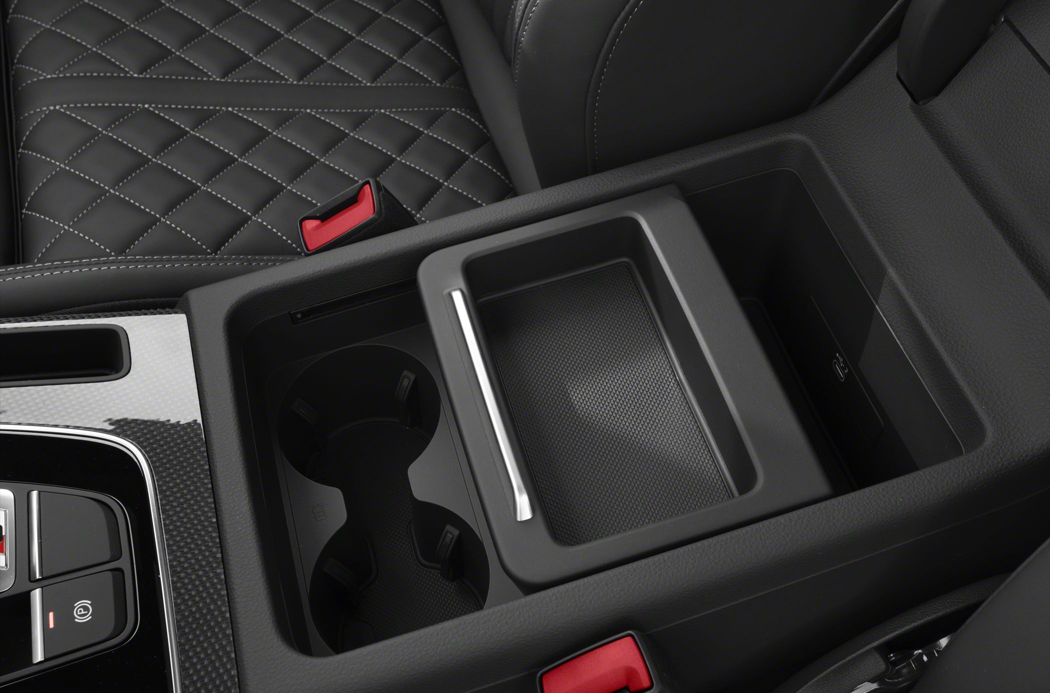 Close-up of luxury center console with cup holders and storage compartment