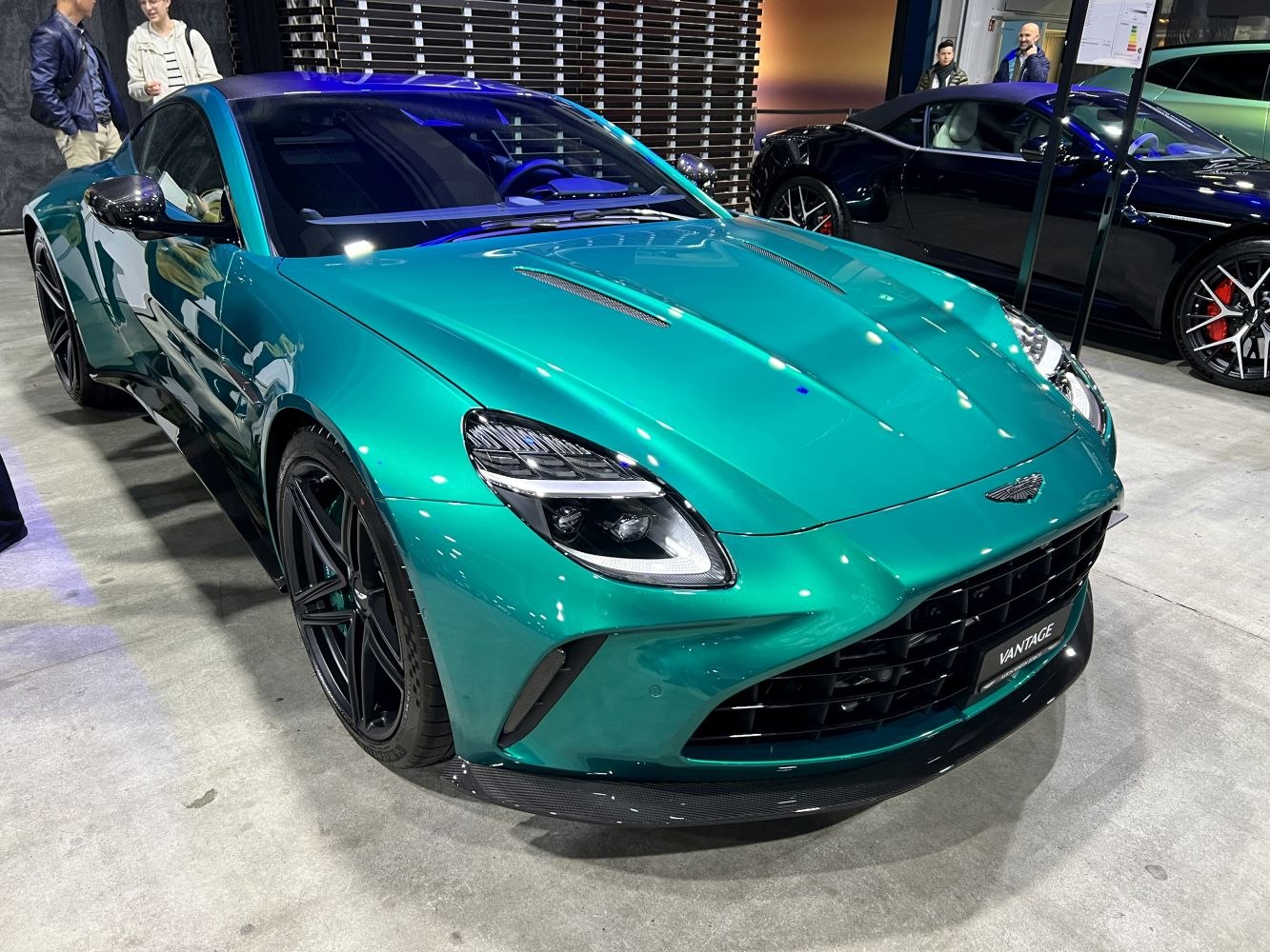 Front view of a sleek sports coupe with LED headlights and aerodynamic vents.