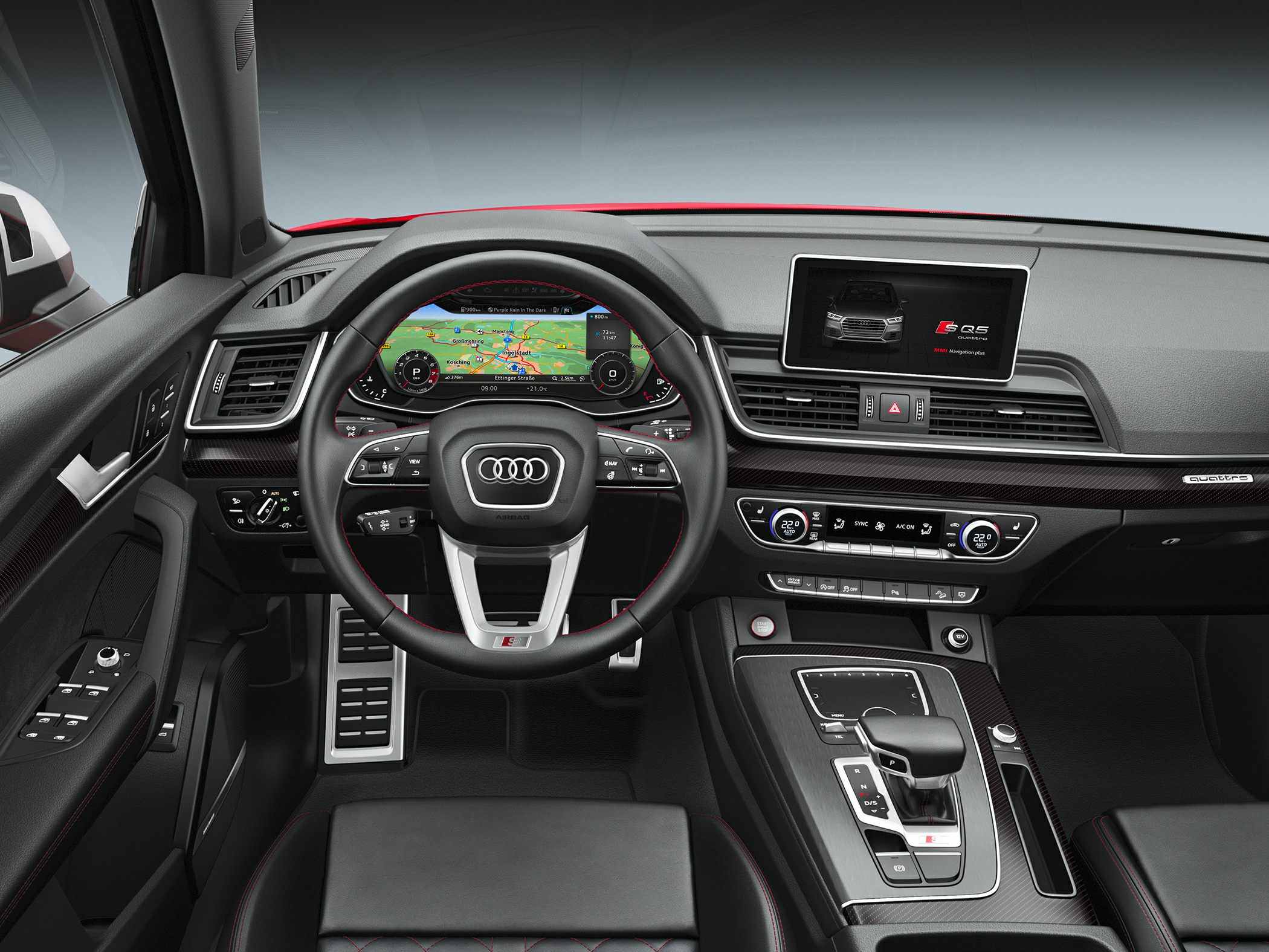 Digital instrument cluster and infotainment screen in luxury car interior