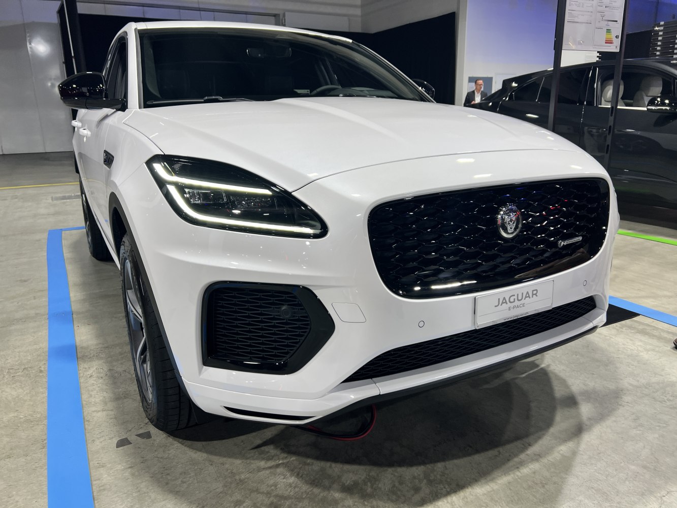 Front view with LED headlights and black mesh grille